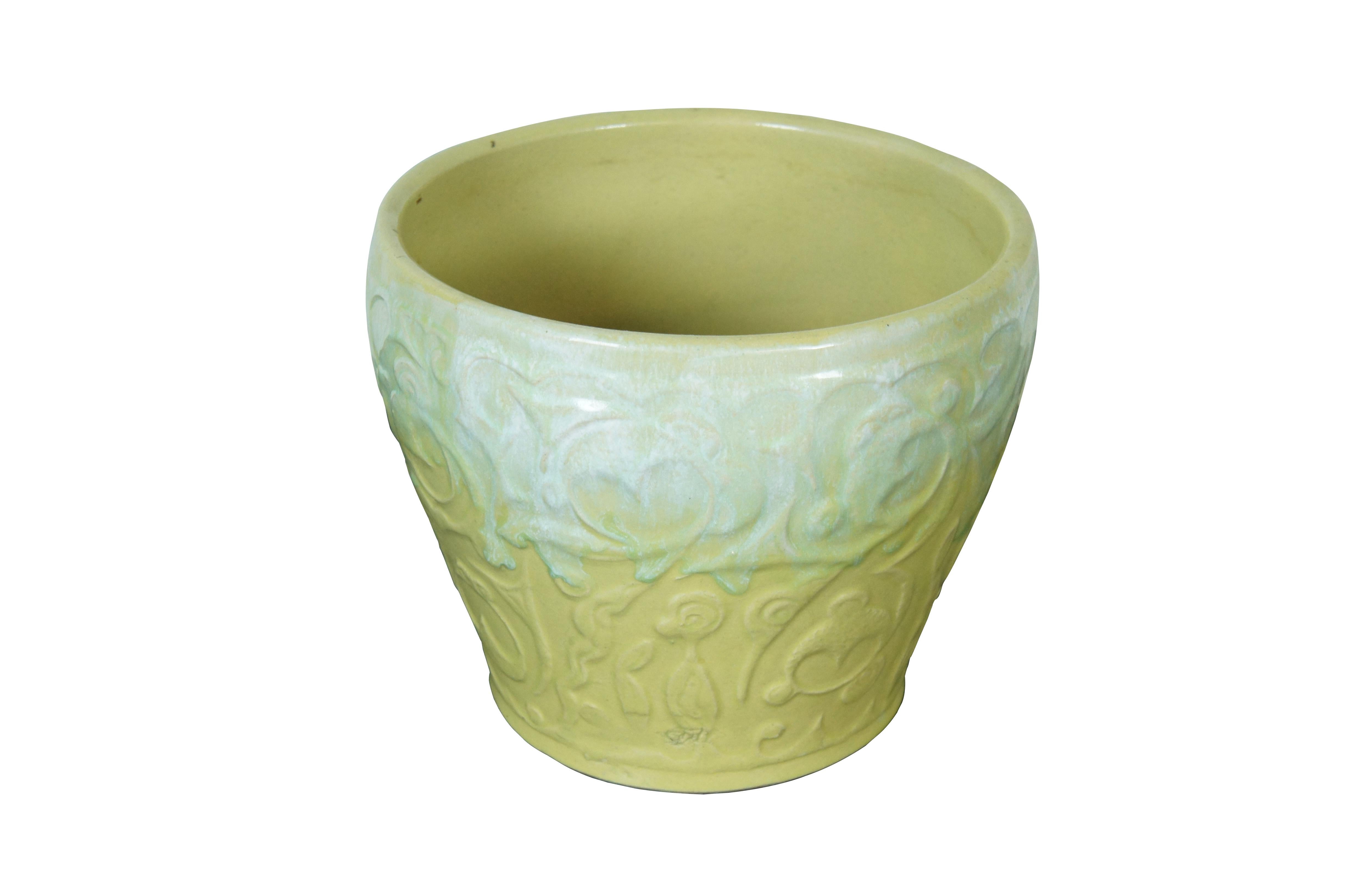 Mid 20th century Roseville Ransbottom two tone yellow and green glazed planter / jardinière. Round form with tapered base, decorated with a motif of swirling stylized flowers and leaves. Incised 
