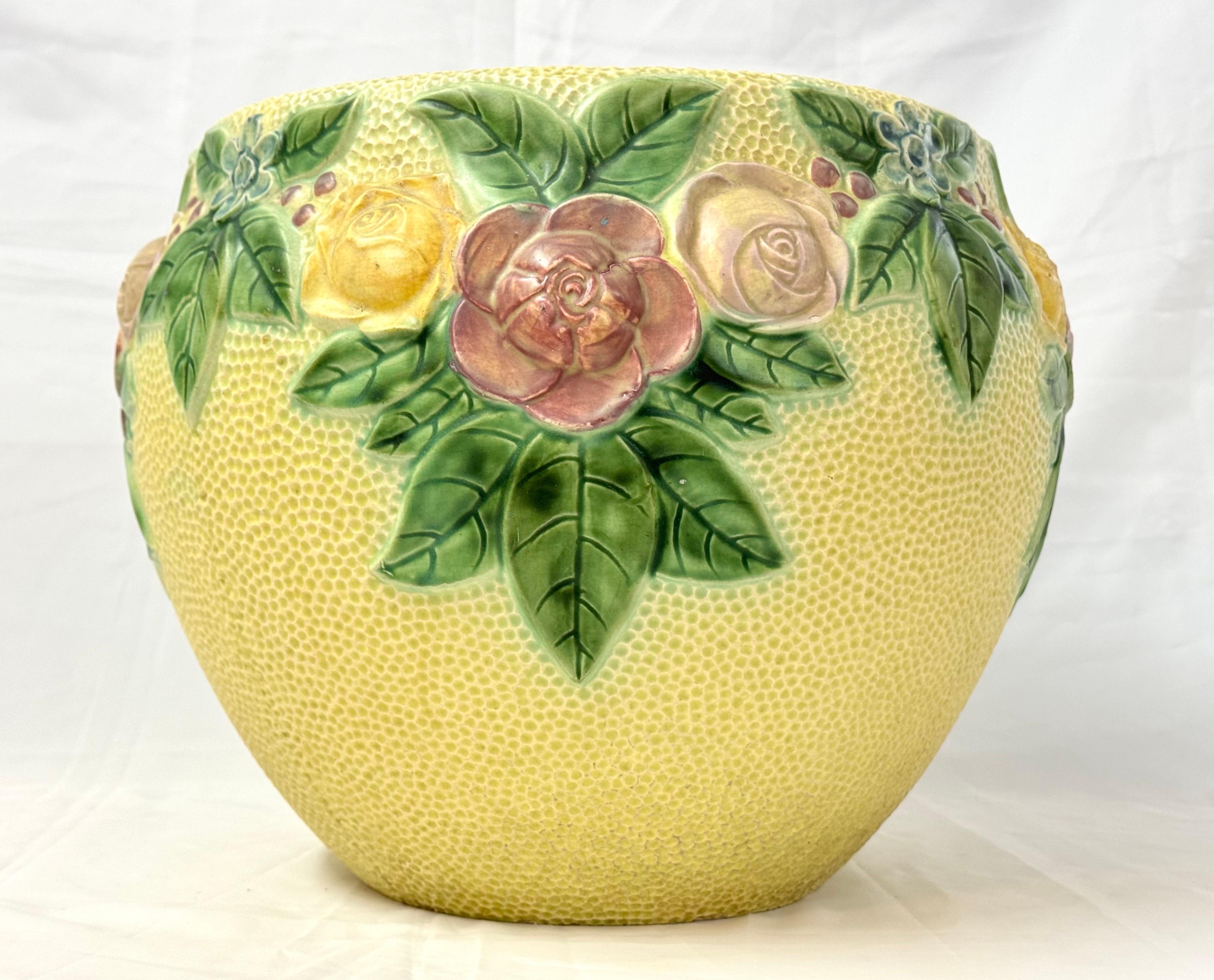 Large Roseville Rozane Floral Ceramic Jardiniere. Gorgeous Yellow and Green tones make up this romantic jardiniere. Large size to hold a gorgeous large plant.  
In 1900 Young hired Ross C. Purdy to create the company's first art pottery line, named