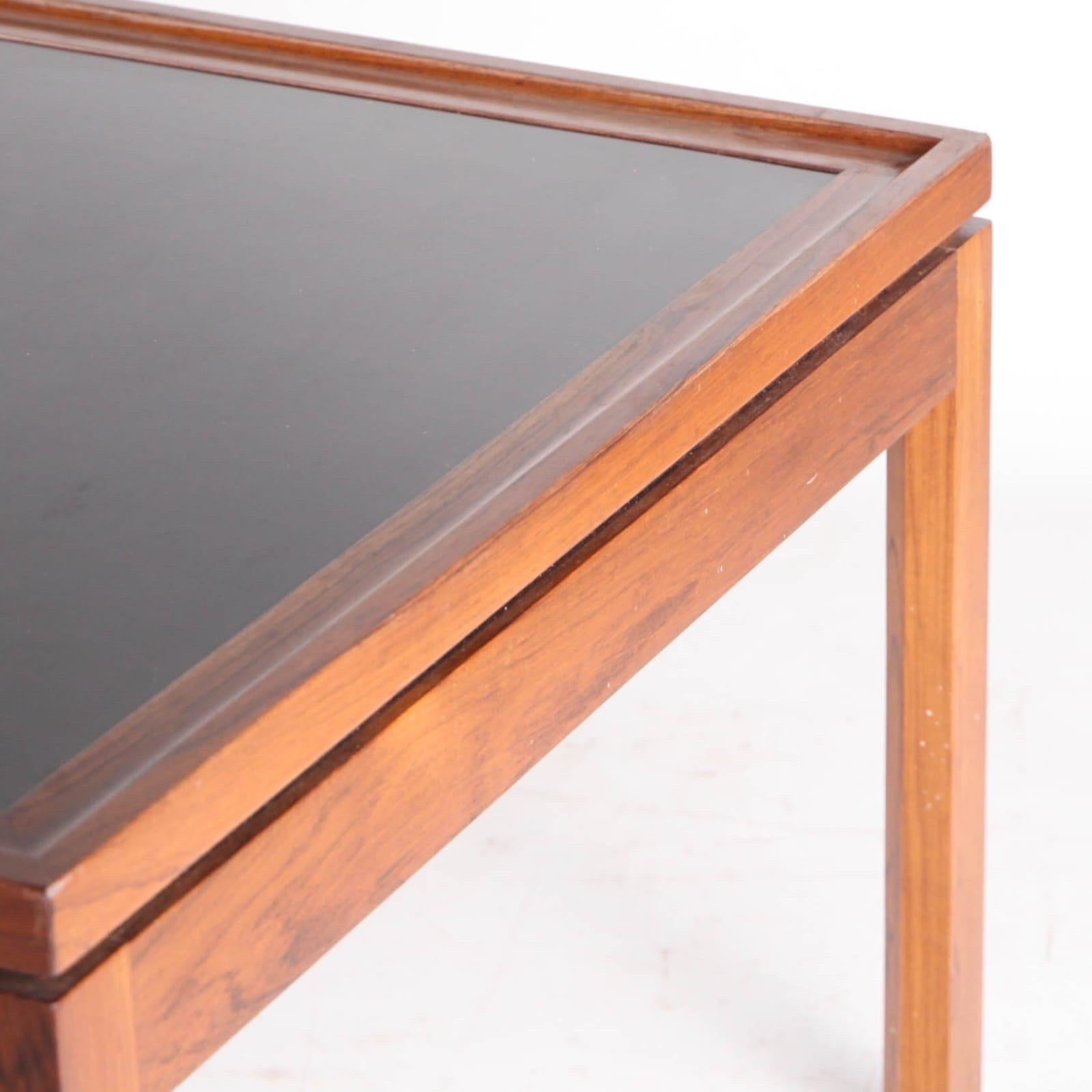 Very large Rio rosewood Scandinavian coffee table with ebonized top from the seventies. High quality, good condition, rare.