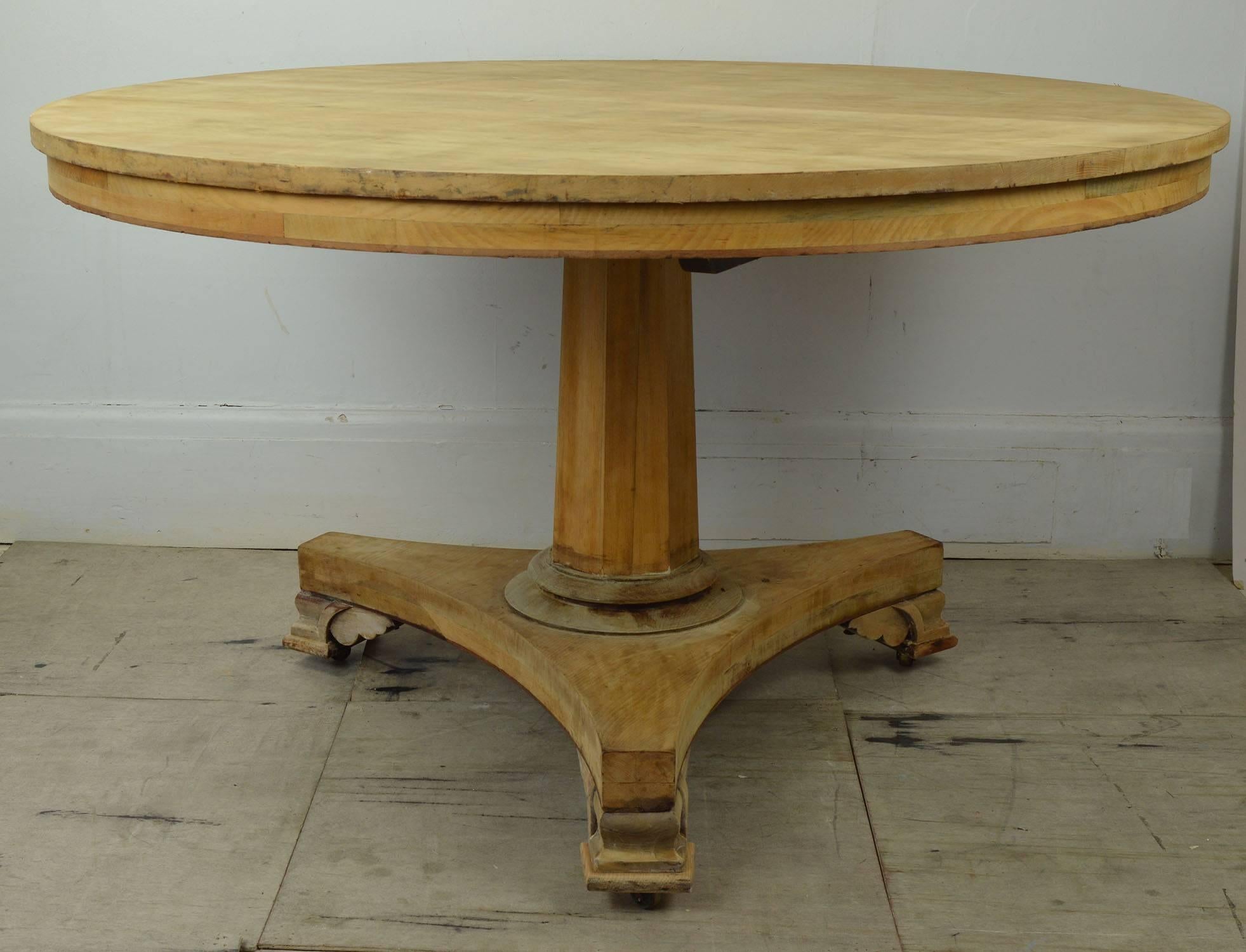 Wonderfully understated round dining or centre table. 

Great simple lines.

I have chosen not to wax the bare wood.

It has the original brass castors so it can easily be pushed around the room.

