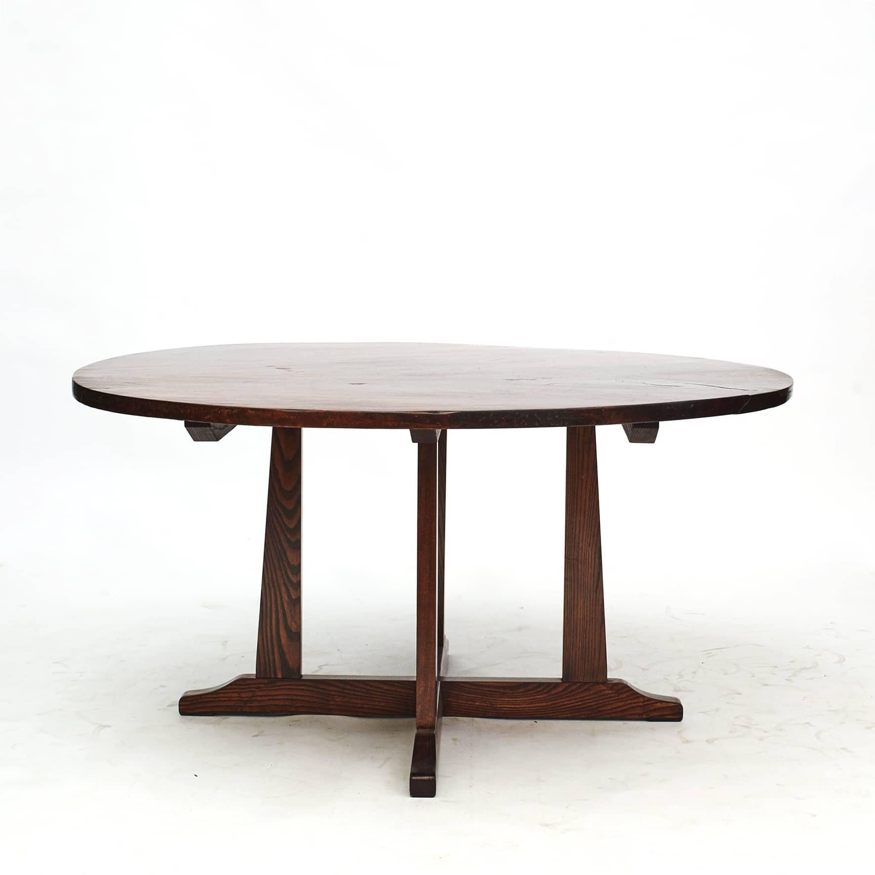 Large round Art Deco dining table.
The table top has a diameter of 155 cm and is crafted in Narra hardwood. Base in elm.

From the Philippines, ca. 1900
Narra is the national tree of the Philippines and a tropical hardwood tree, often referred