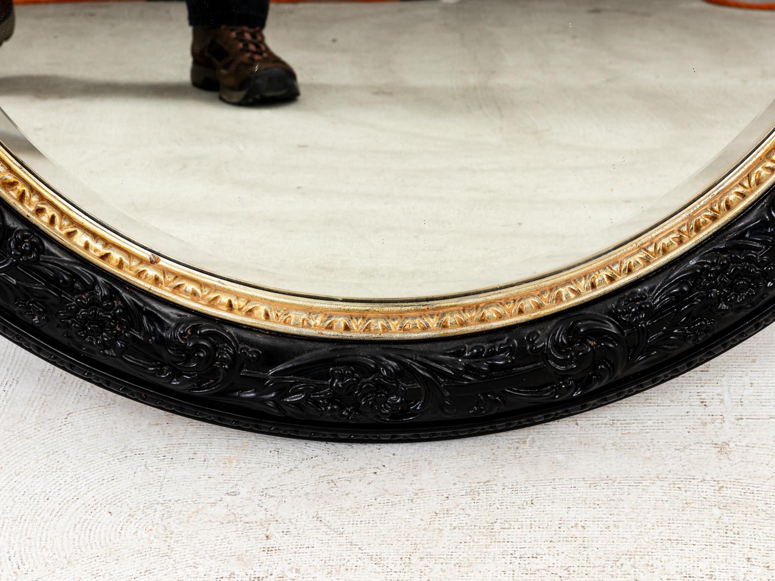 round black and gold mirror