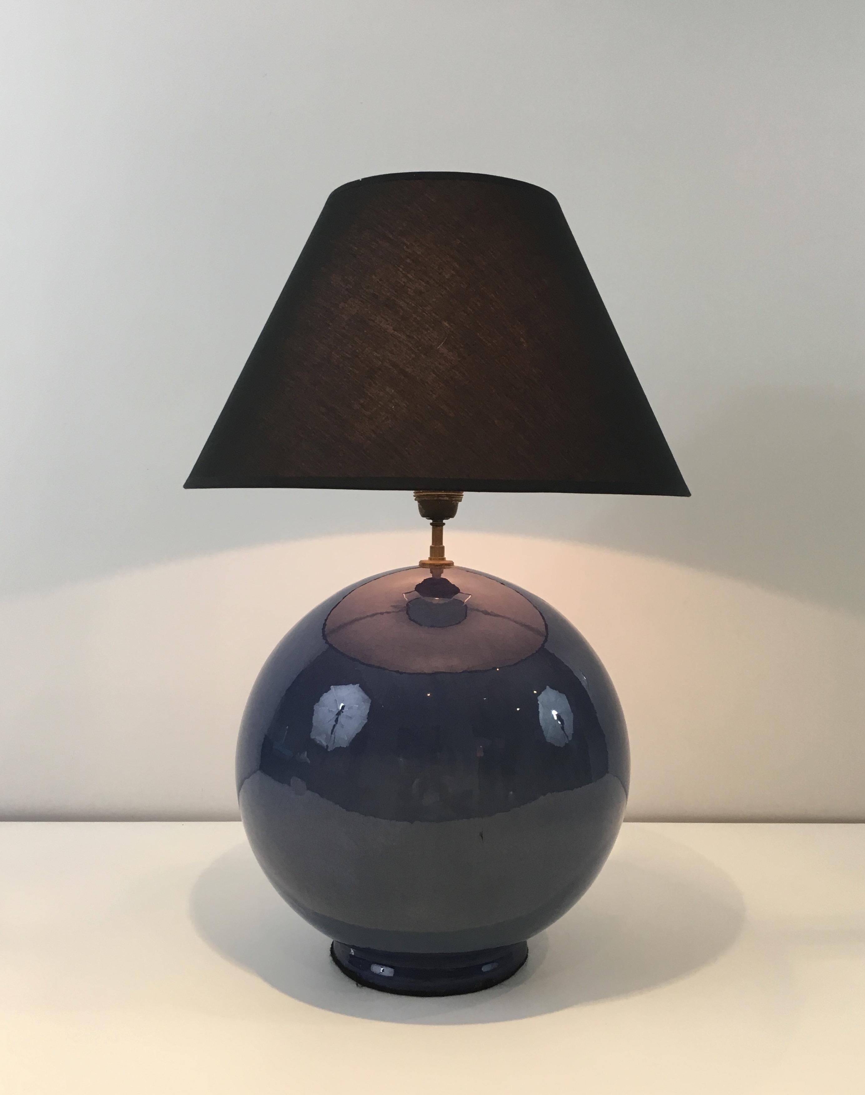 This large table lamp is made of a beautiful blue ceramic. This is a French work, circa 1970.