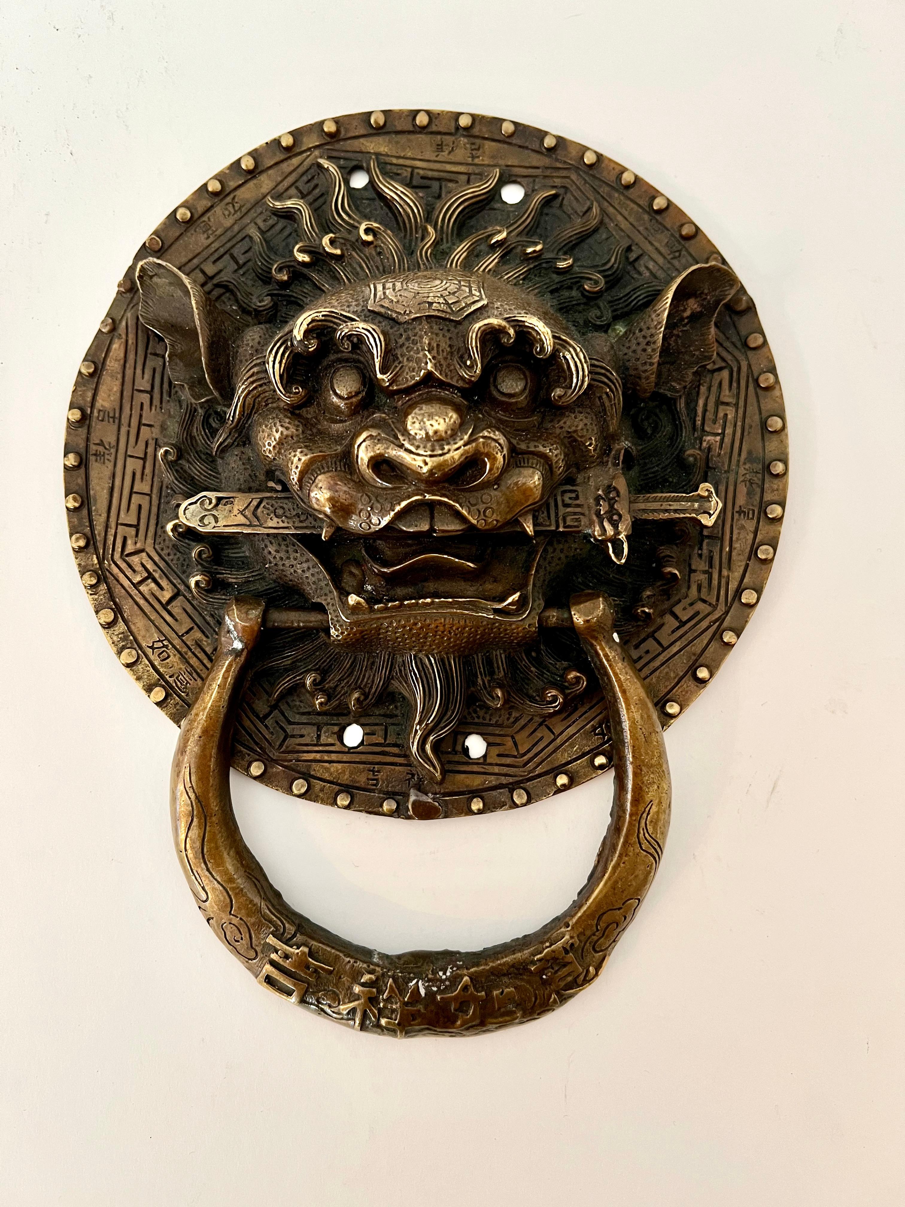 A large and unique bronze foo dog door knocker - the size and scale are impressive and eye catching. For the home that has an Asia influence. The patination of the bronze is very deep and important. A compliment o many entrances and also could be a