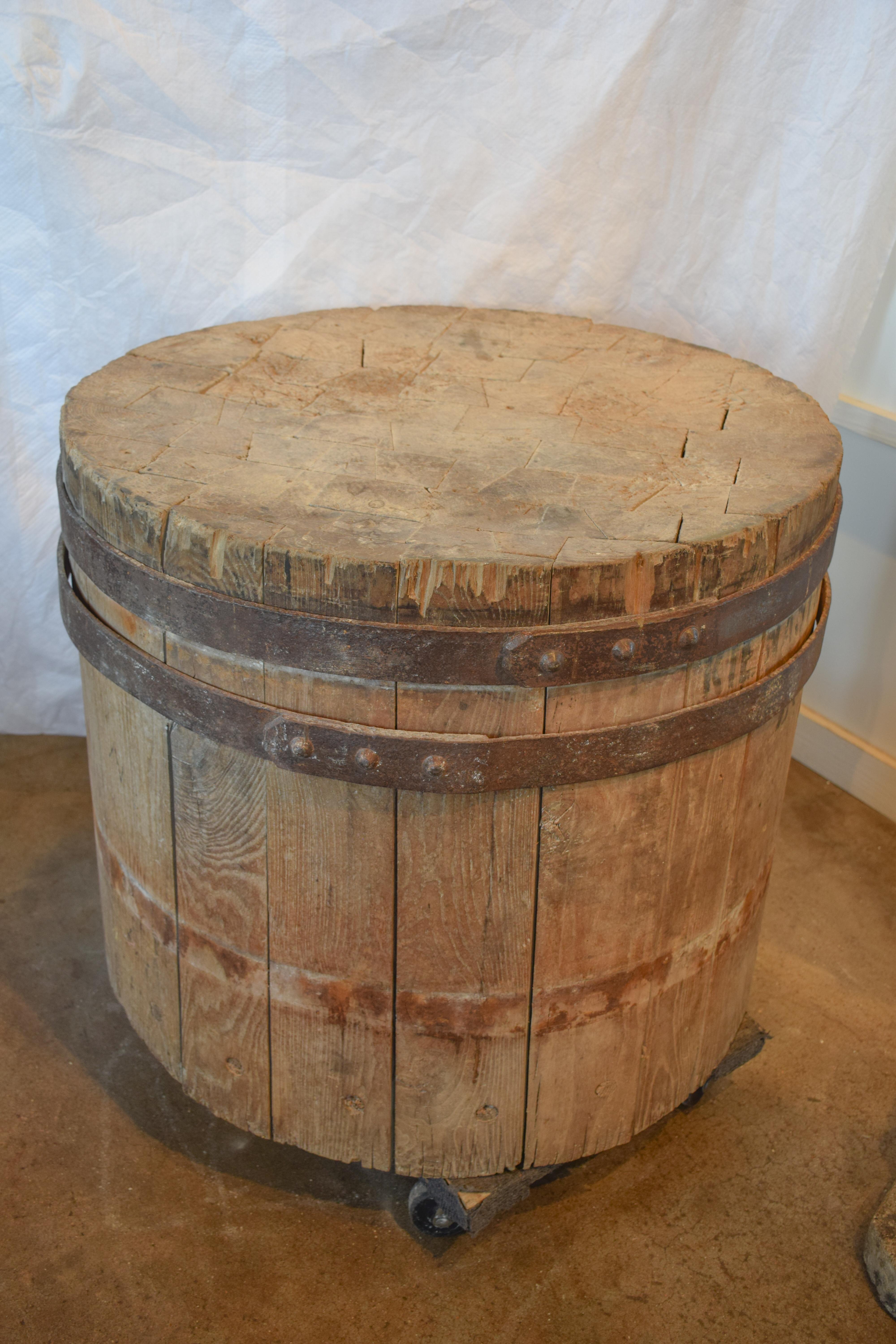 Perfection is the best adjective to describe this one of a kind Large Round Butcher block. Imagine the meals that originated from this piece of art. Adorned with two forged Iron bands and stamped with 