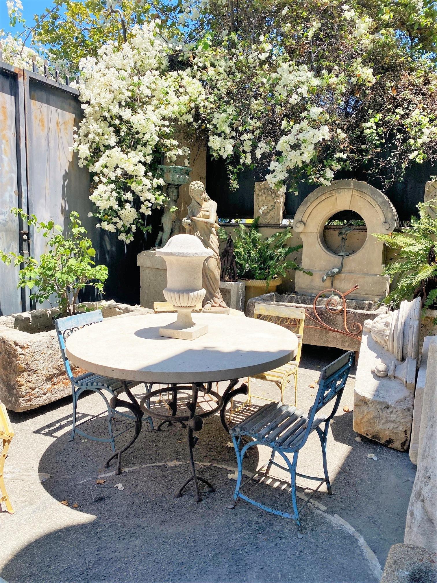 Large Round Carved Stone & Iron Garden Patio Dining Table Giacometti Style  LA CA . Hand Crafted and carved round stone  garden patio coffee outdoor indoor table for Six people or more .  It will be the perfect touch by an outdoor fireplace or on