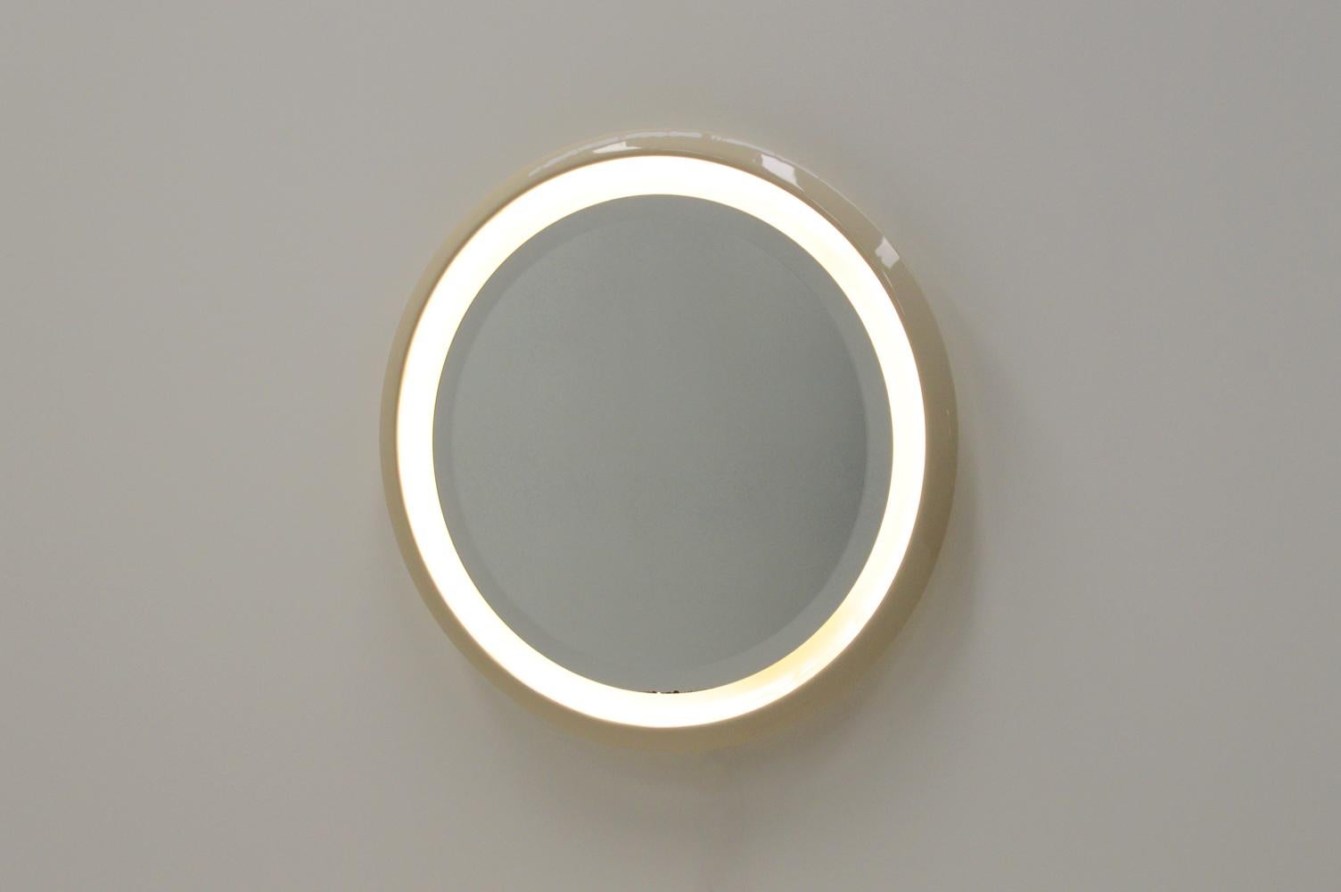 Mid-Century Modern Large round ceramic mirror with lighting, 1960s. For Sale