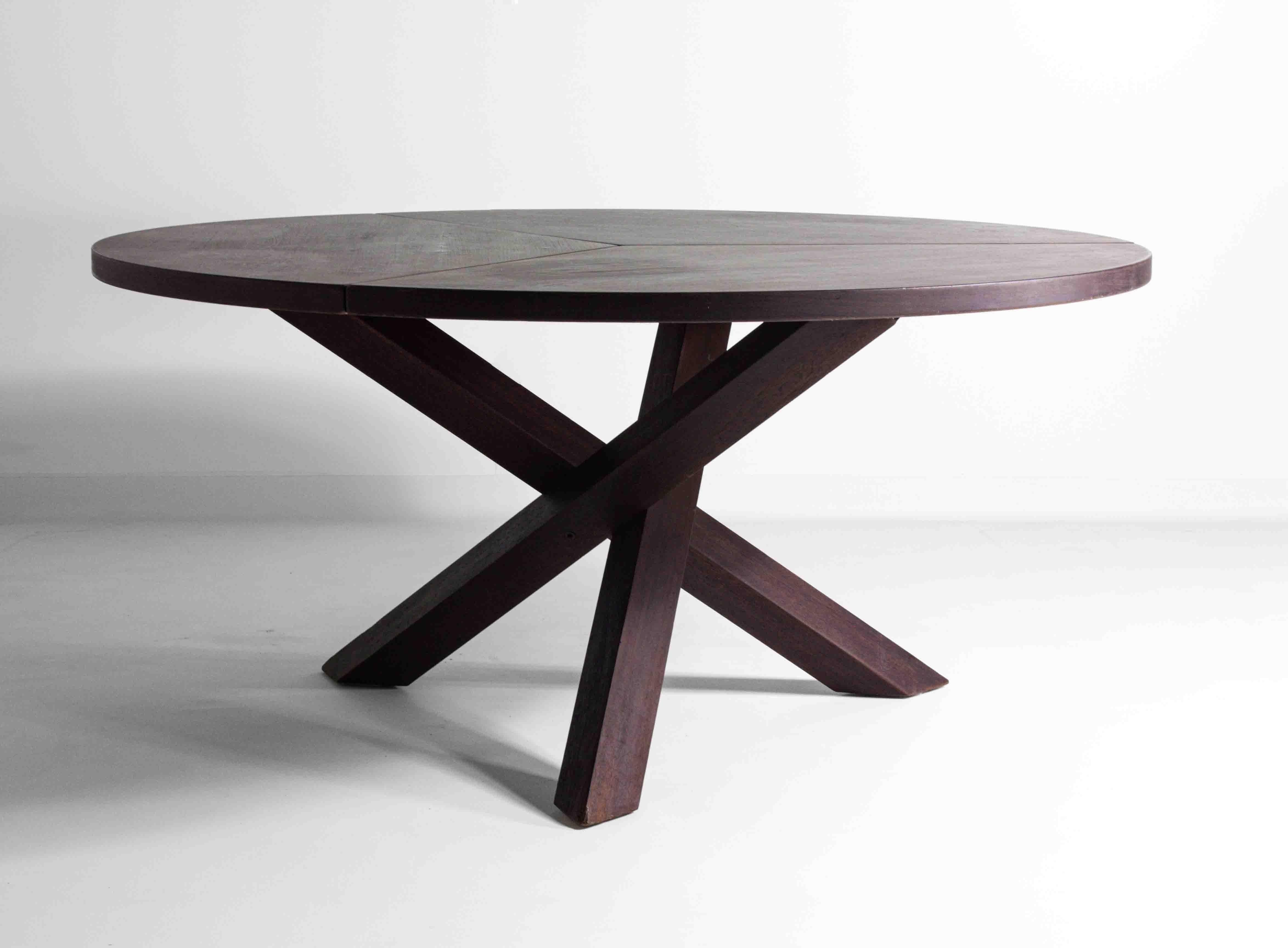 This large round dining table, designed by Gerard Geytenbeek for AZS Meubelen in the 1960s, is crafted from high-quality dark wengé wood. The table features a distinct tripod base consisting of three crossed legs, providing both stability and a