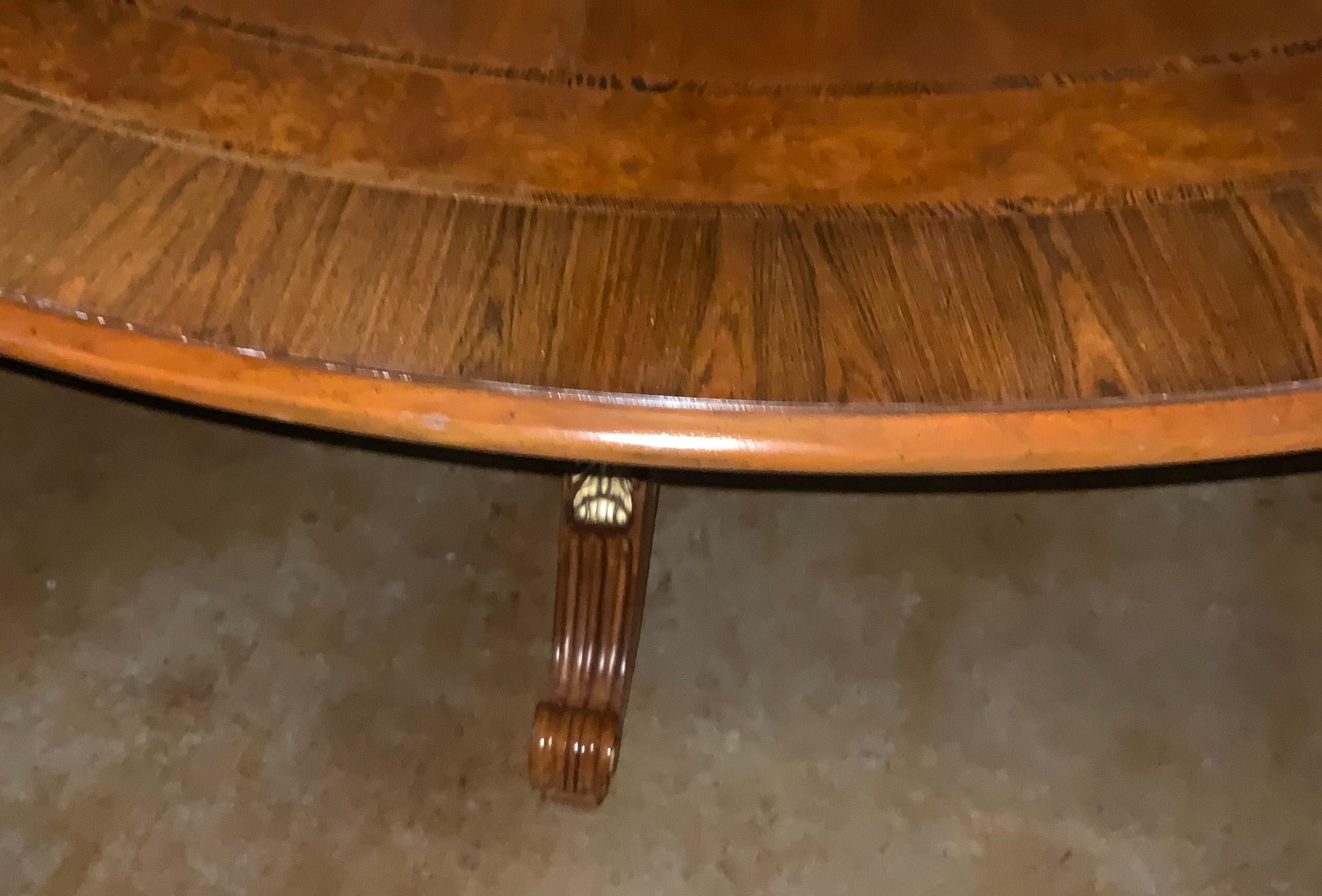 This table is 83.5” in diameter so it will seat up to ten people
Comfortably. It is well made in walnut with inlay of rosewood.
The finish has been buffed to a high sheen. It has been gently
Used and is good condition. The pedestal has four