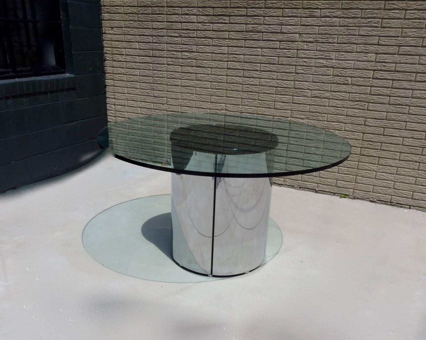 Very clean one inch thick glass top on clean polished stainless steel cylinder base. Attributed to Pace or Brueton.