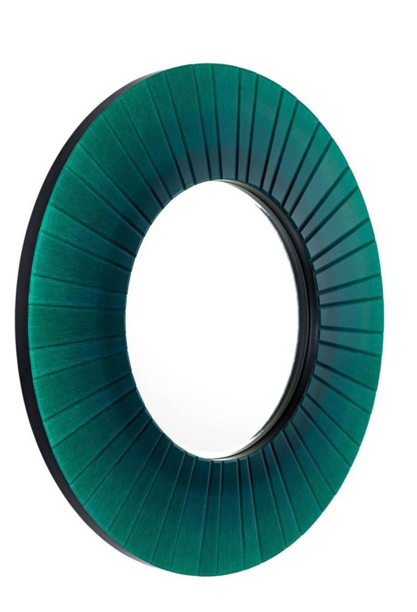 Large round beveled glass mirror. Colored glass features harmonious blue to green scheme.
 
Measurements: 43