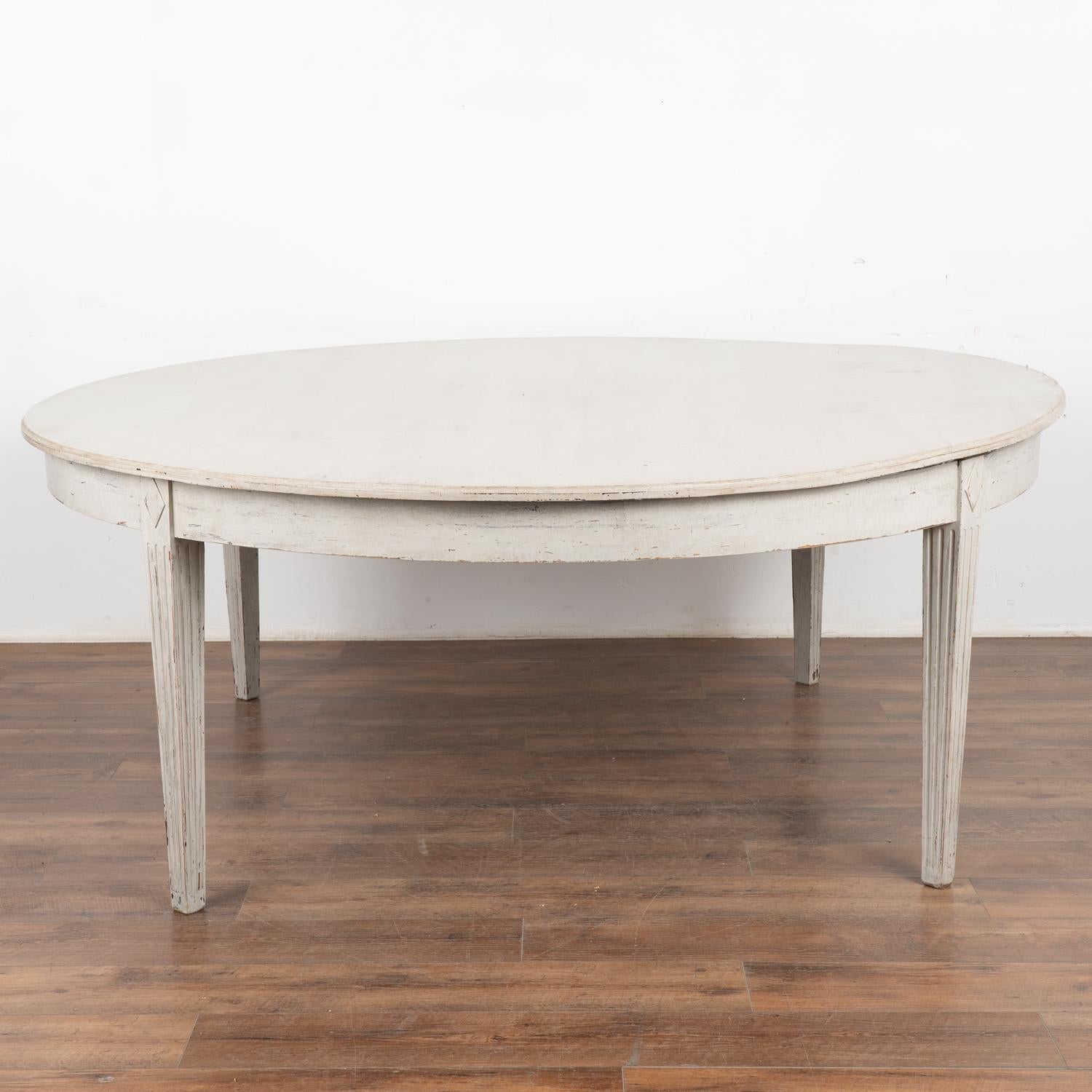 Round dining table, 6.5' diameter with the look of the Gustavian style.
This size table did not exist in the Gustavian period; this new table mirrors the Swedish style in a larger size for today's modern home.
Lovely tapered fluted legs and applied