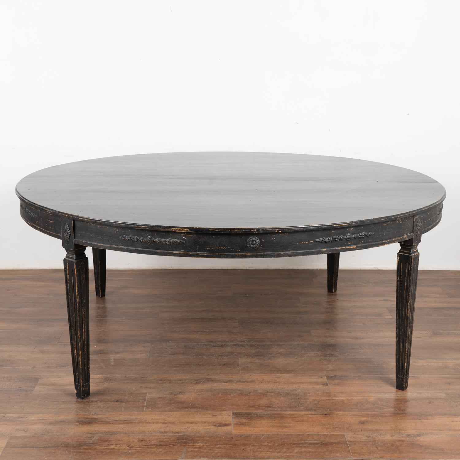 Round dining table, 6.5' diameter with the look of the Gustavian style.
This size table did not exist in the Gustavian period; this new table mirrors the Swedish style in a larger size for today's modern home.
Lovely tapered fluted legs and applied