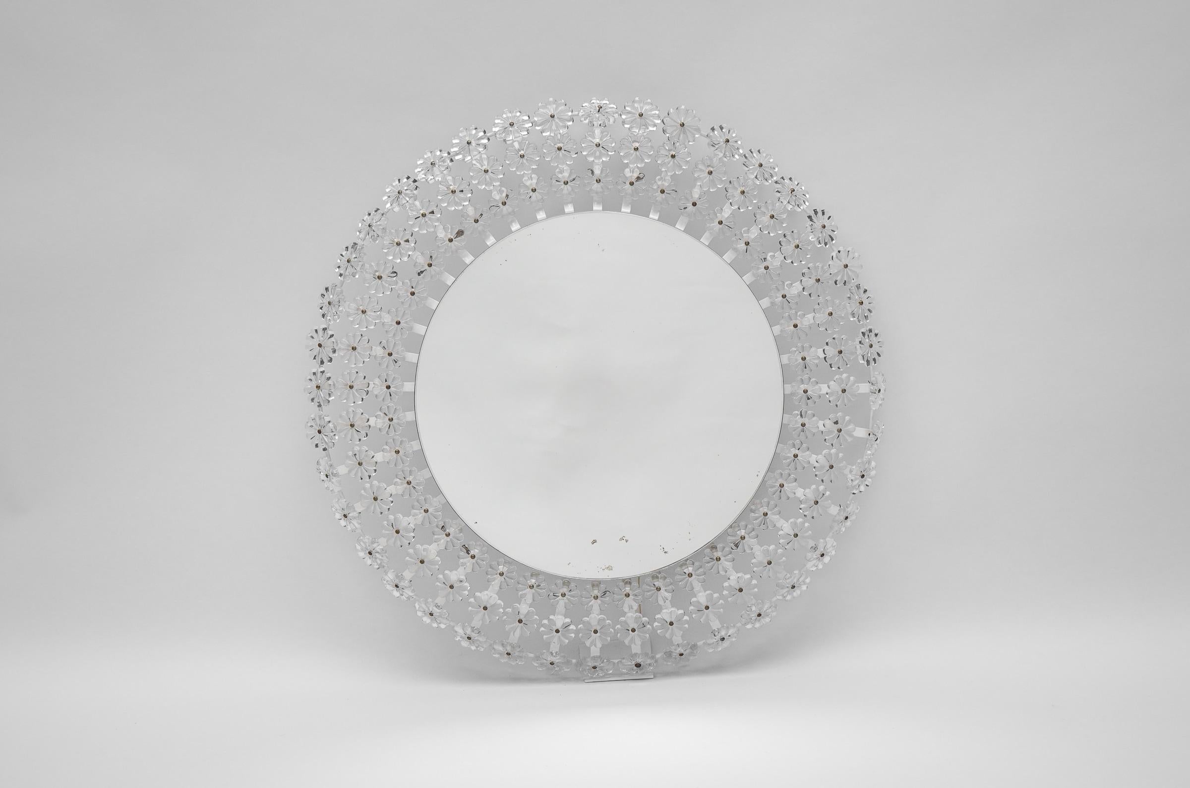 A beautiful large round flower wall mirror with illuminated background and hundreds of Lucite blossoms, Austria. Fine working condition. 

A round wall mirror with a circular tube light behind it.