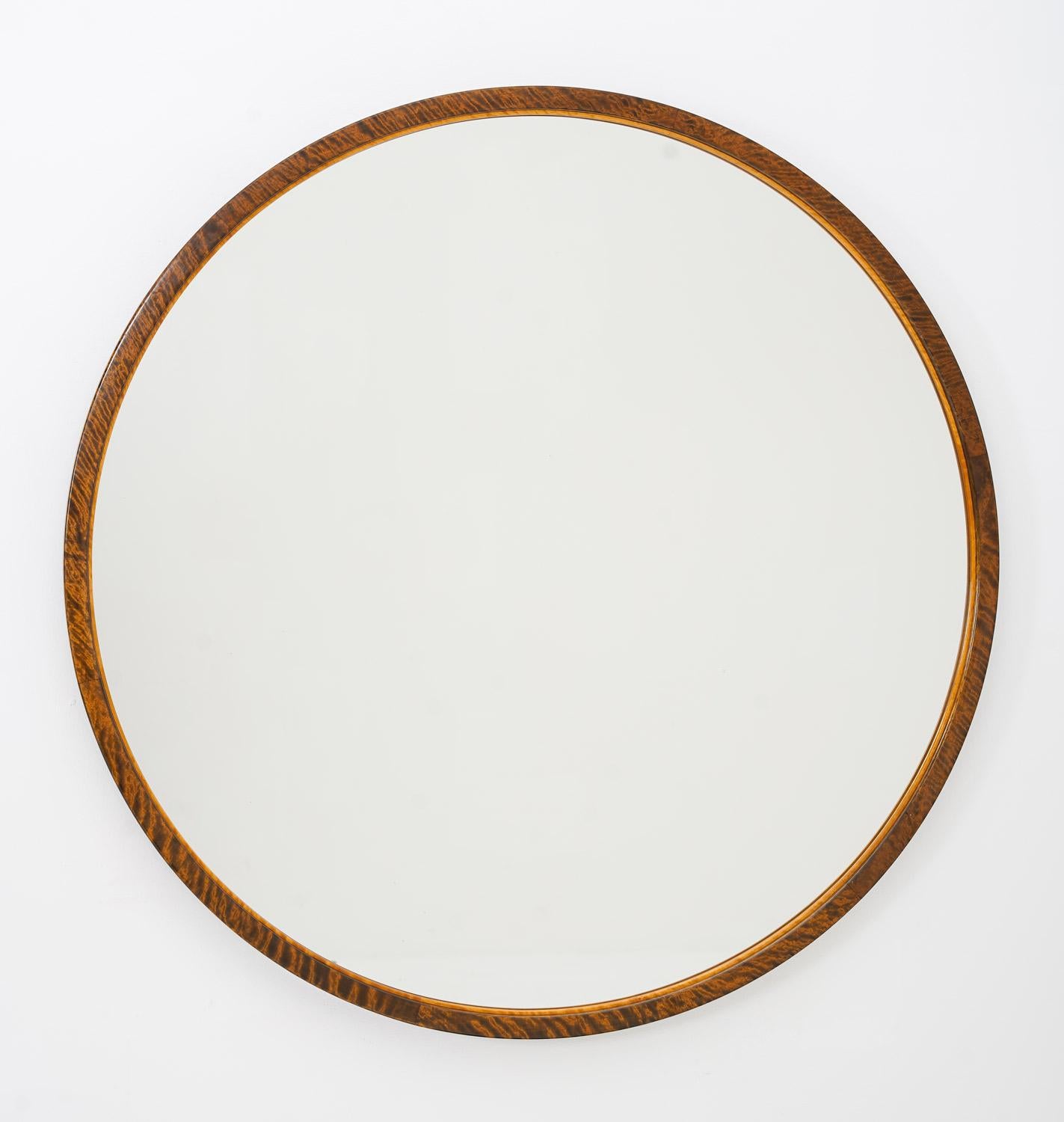 This rare mirror by Otto Schulz for Boet is a stunning piece of art that dates back to the 1930s, hailing from Sweden. This mirror boasts an impressively large size, and its round frame is made of high-quality birch wood, adorned with intricate