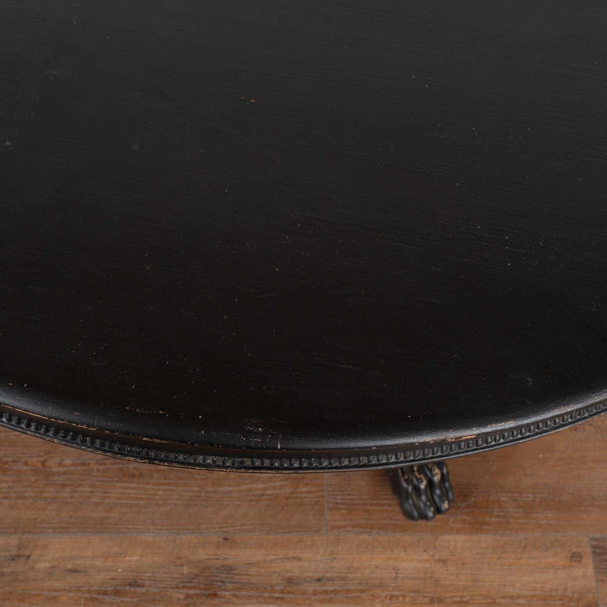 large round black dining table
