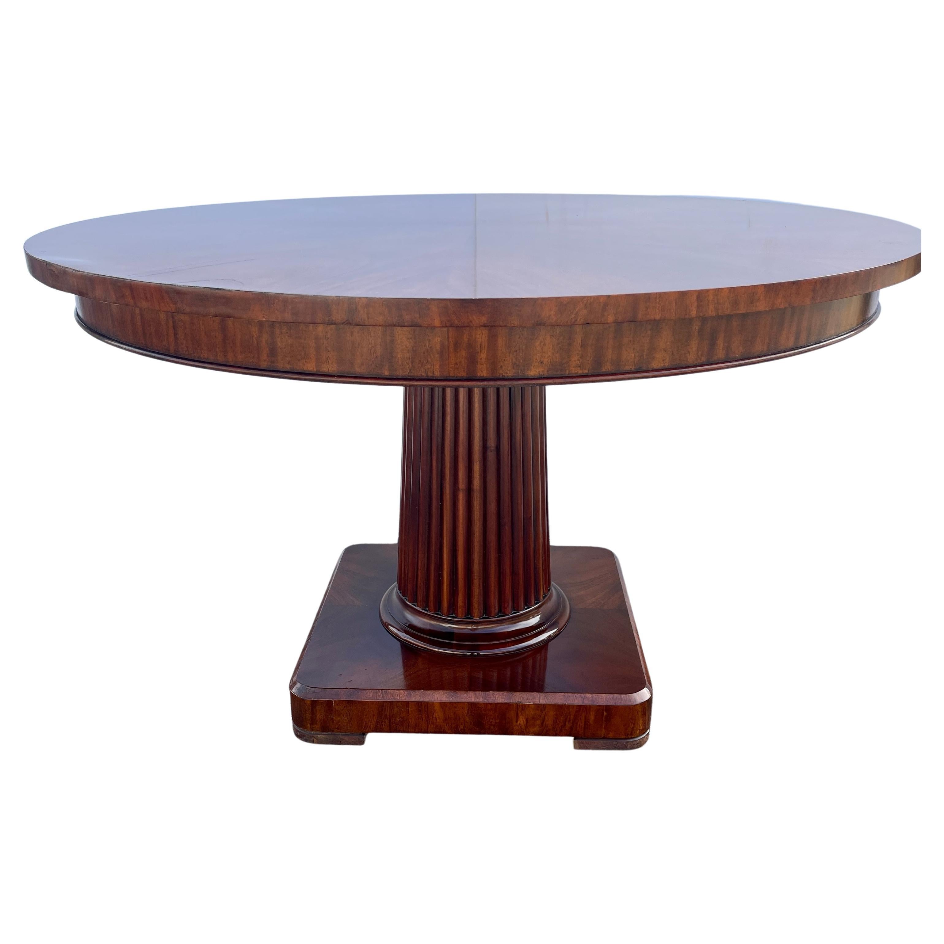 Mahogany round pillar table by Ralph Lauren Fine Furniture Maker.
This bench-made table has been produced and finished with the highest level of hand-craftsmanship. Finely crafted from kiln-dried mahogany wood and hand-selected swirl mahogany wood