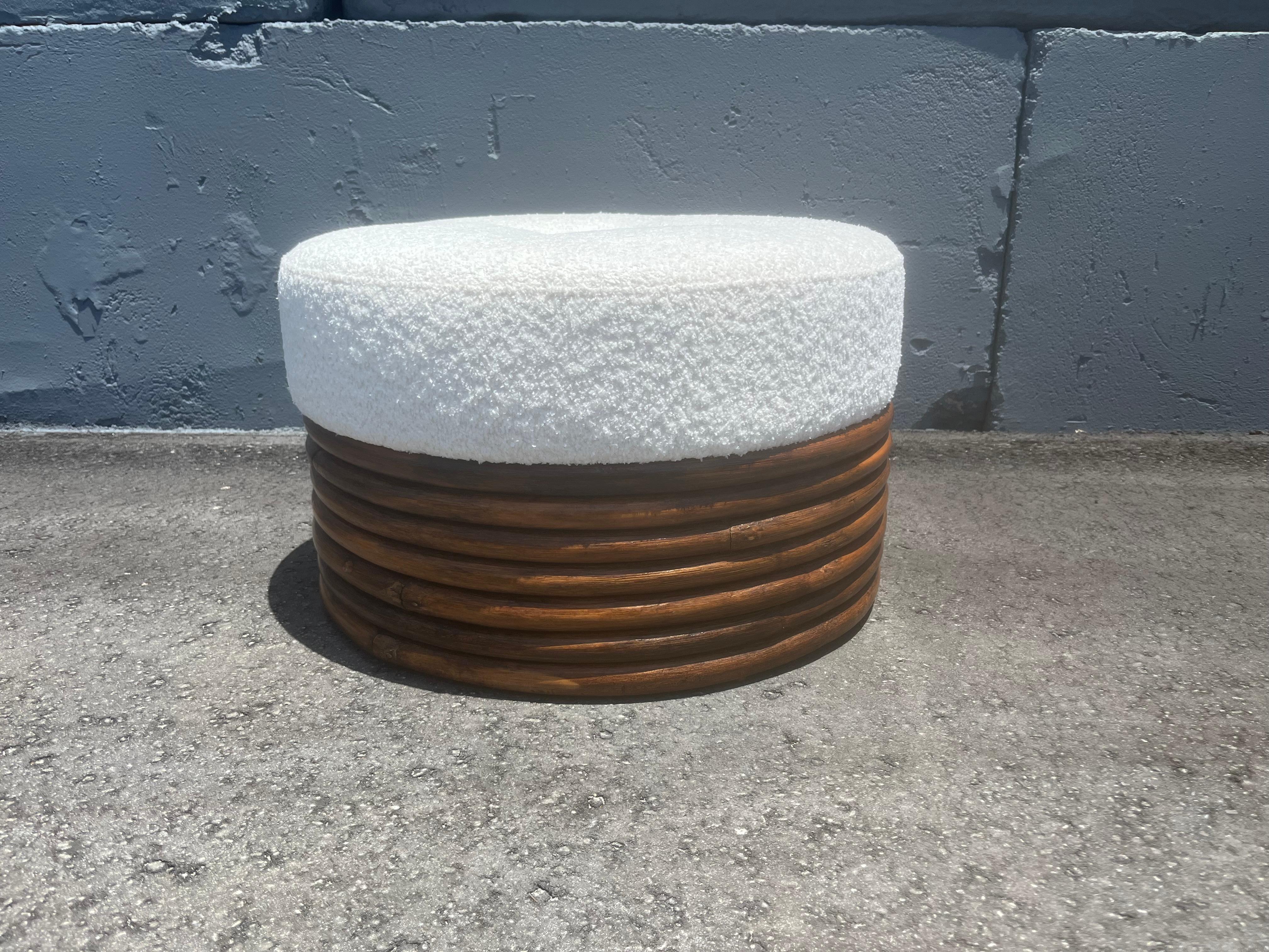 Round Rattan Ottoman, white boucle fabric seat. Ready for a new home.