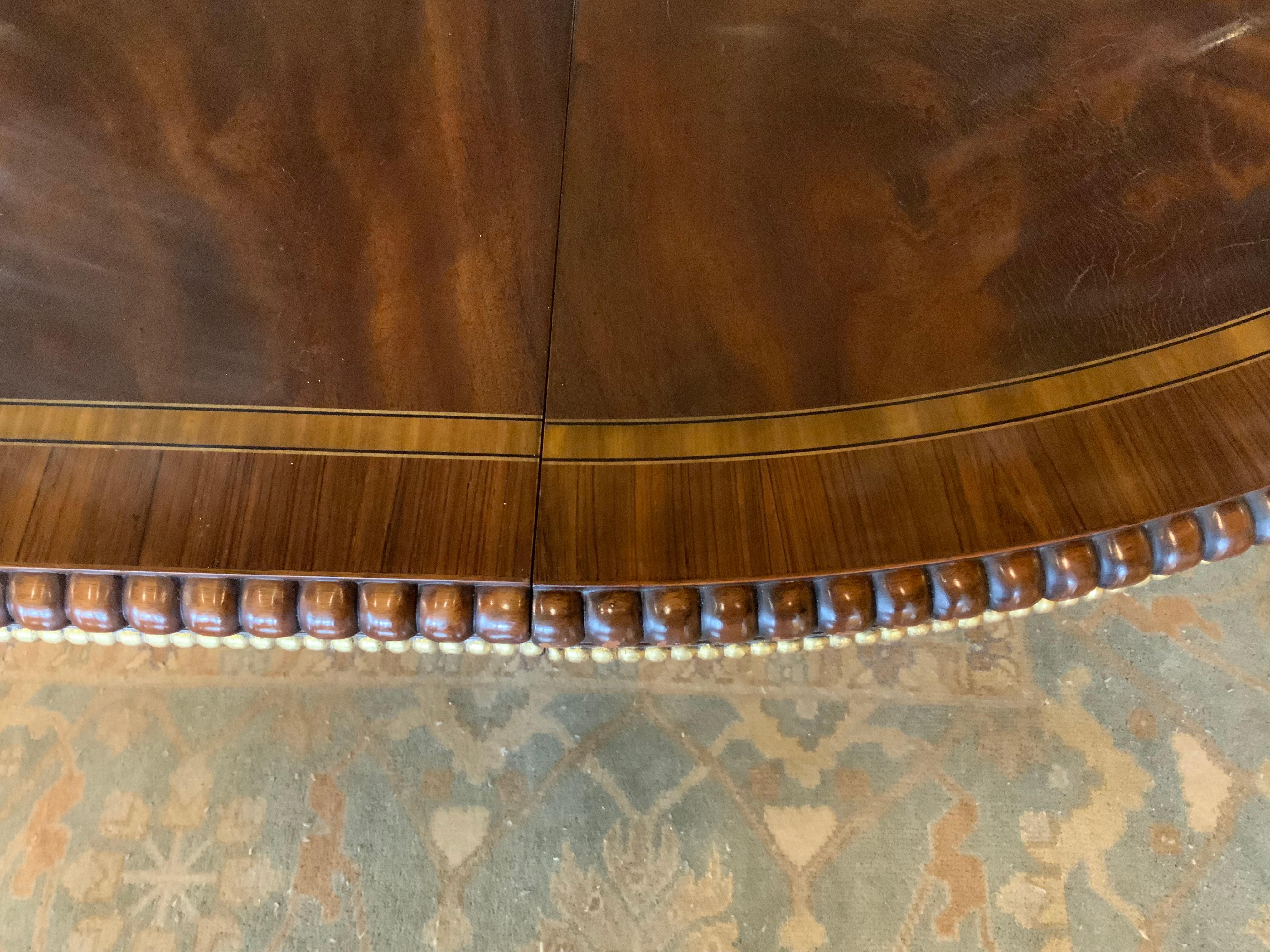 American Large  round regency style dining table converts to long oval For Sale