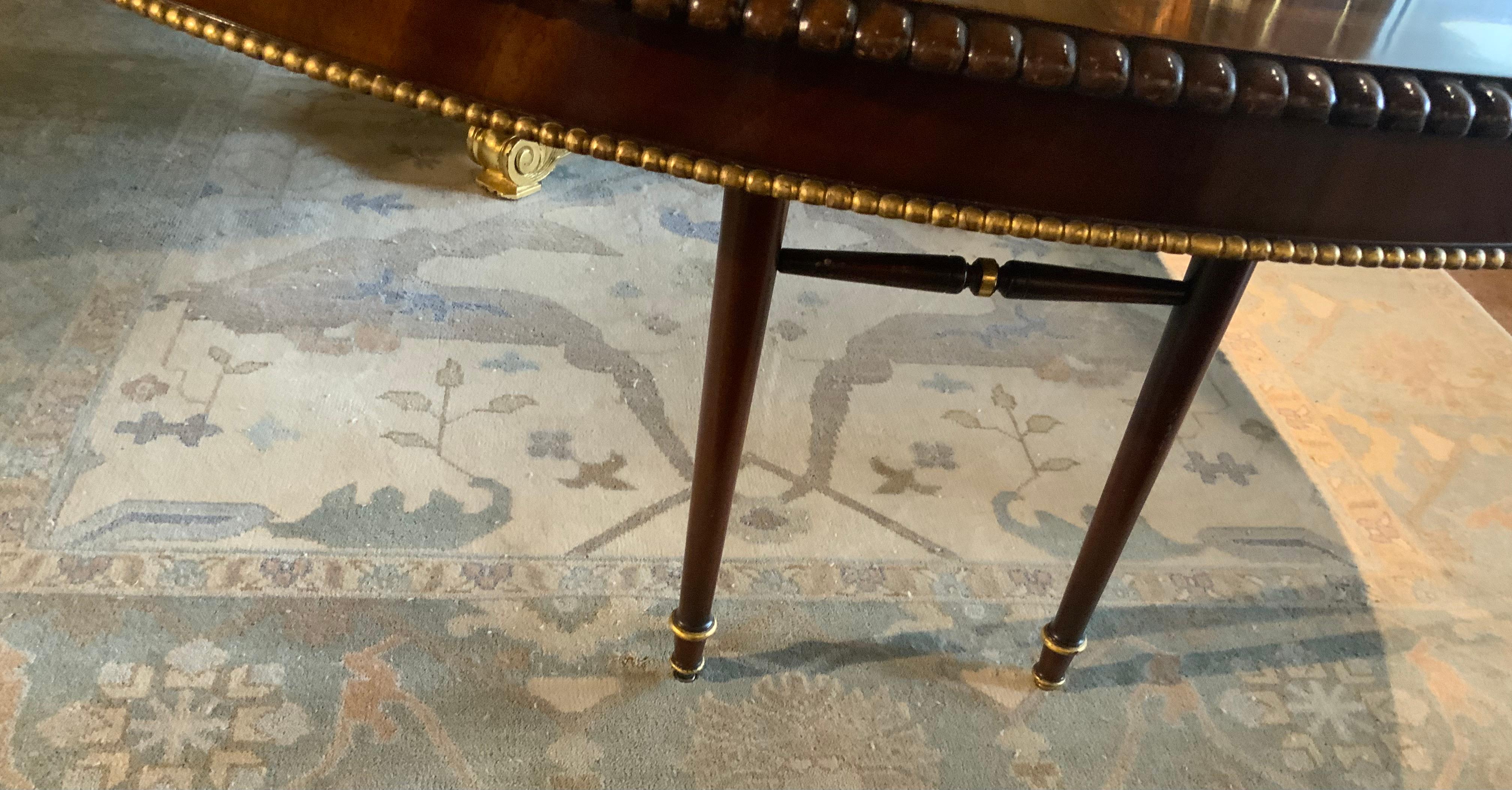 Large  round regency style dining table converts to long oval In Excellent Condition For Sale In Houston, TX