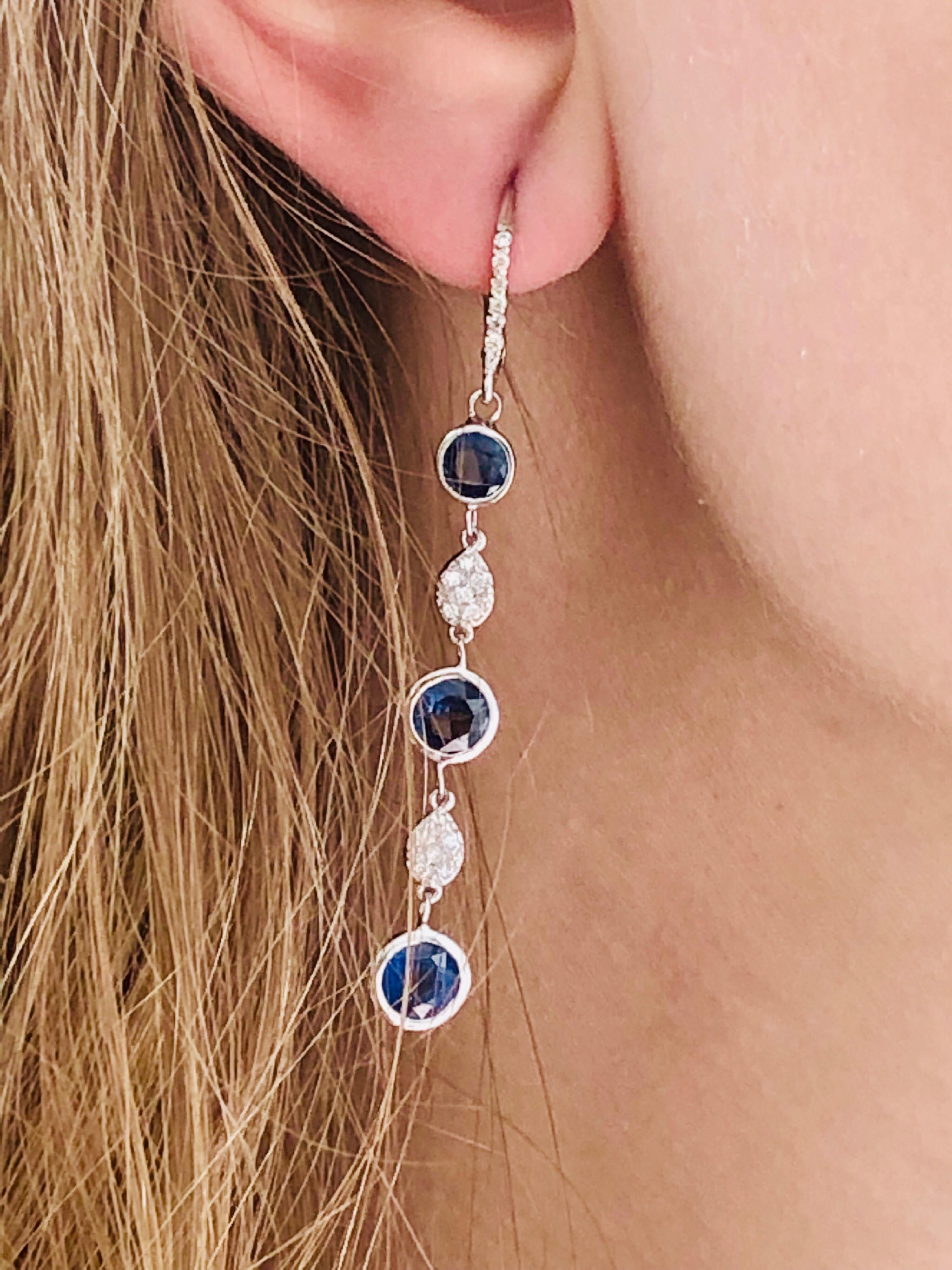 Fourteen karats white gold hoop drop earrings two and half-inch long
Diamonds weighing 0.75 carat 
Total of six-round sapphires weighing 5 carat
Pair of round sapphire weighing 2.40 carat measuring 6 millimeter 
Pair of round sapphire weighing 1.60