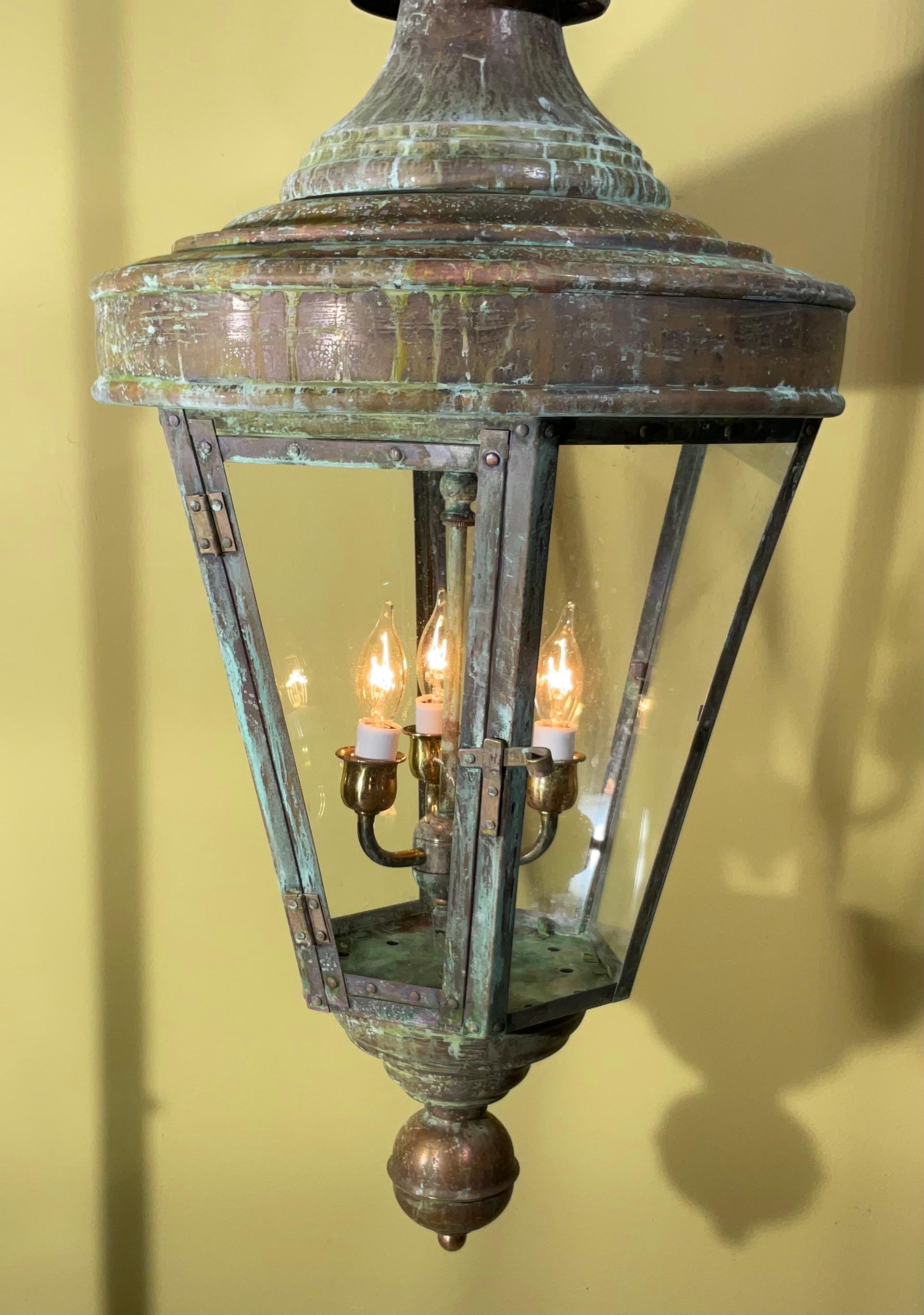 Beautiful handcrafted lantern made of solid copper with three 60/watt lights.
Electrified and ready to use , Beautiful oxidization patina.
This lantern was originally gas lantern , and converted to become electric lantern 
exceptional object of art