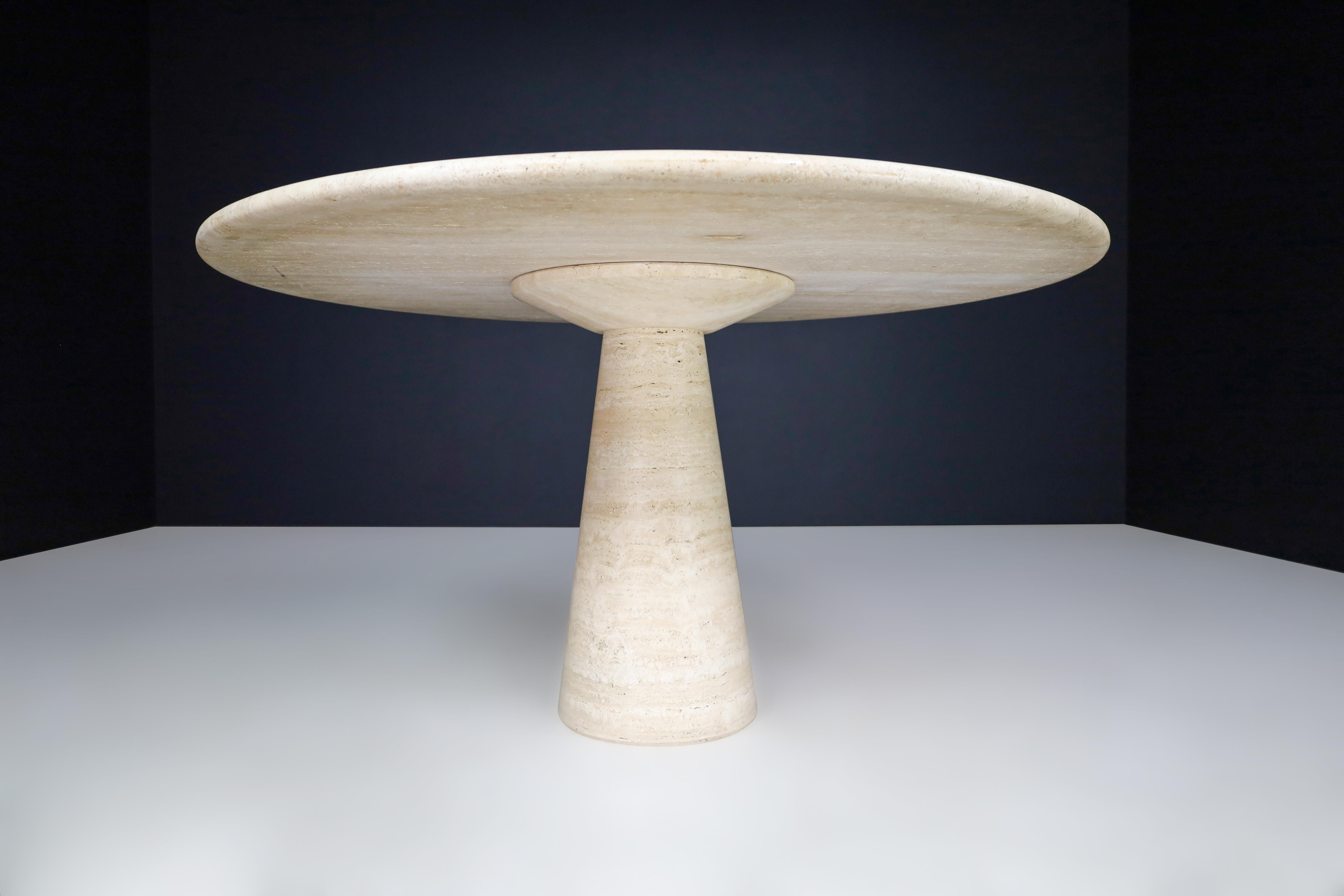 Mid-Century Modern Round Travertine Dining or Centre Table, Italy, 1970s  

This stunning large round travertine dining table or center table was made in Italy in the 1970s. It has a modern and minimalist design that is the style of Angelo
