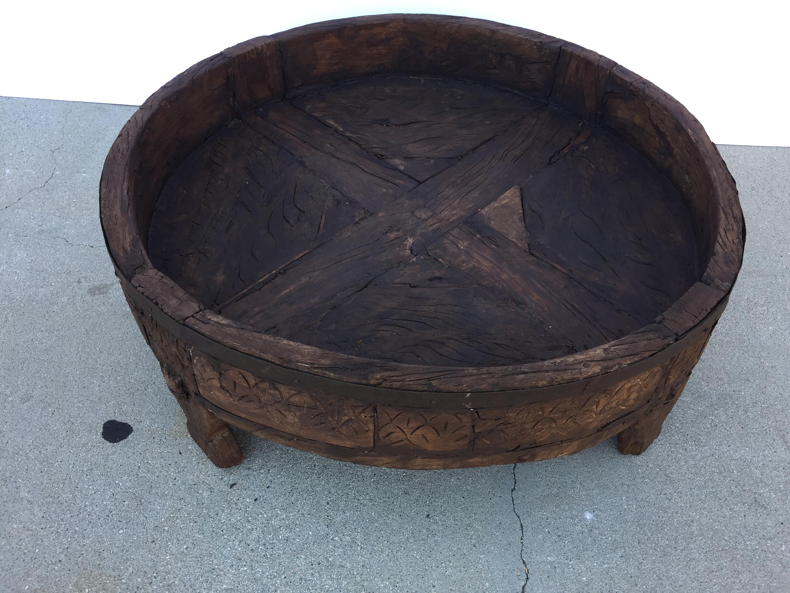 Large hand carved wood Indian grinder tribal teak table.
Dark walnut color hand carved with geometric African design.
Handcrafted of wood and iron, hand carved with geometric Ethnic tribal design.
Very sturdy rustic wood table with nice patina,