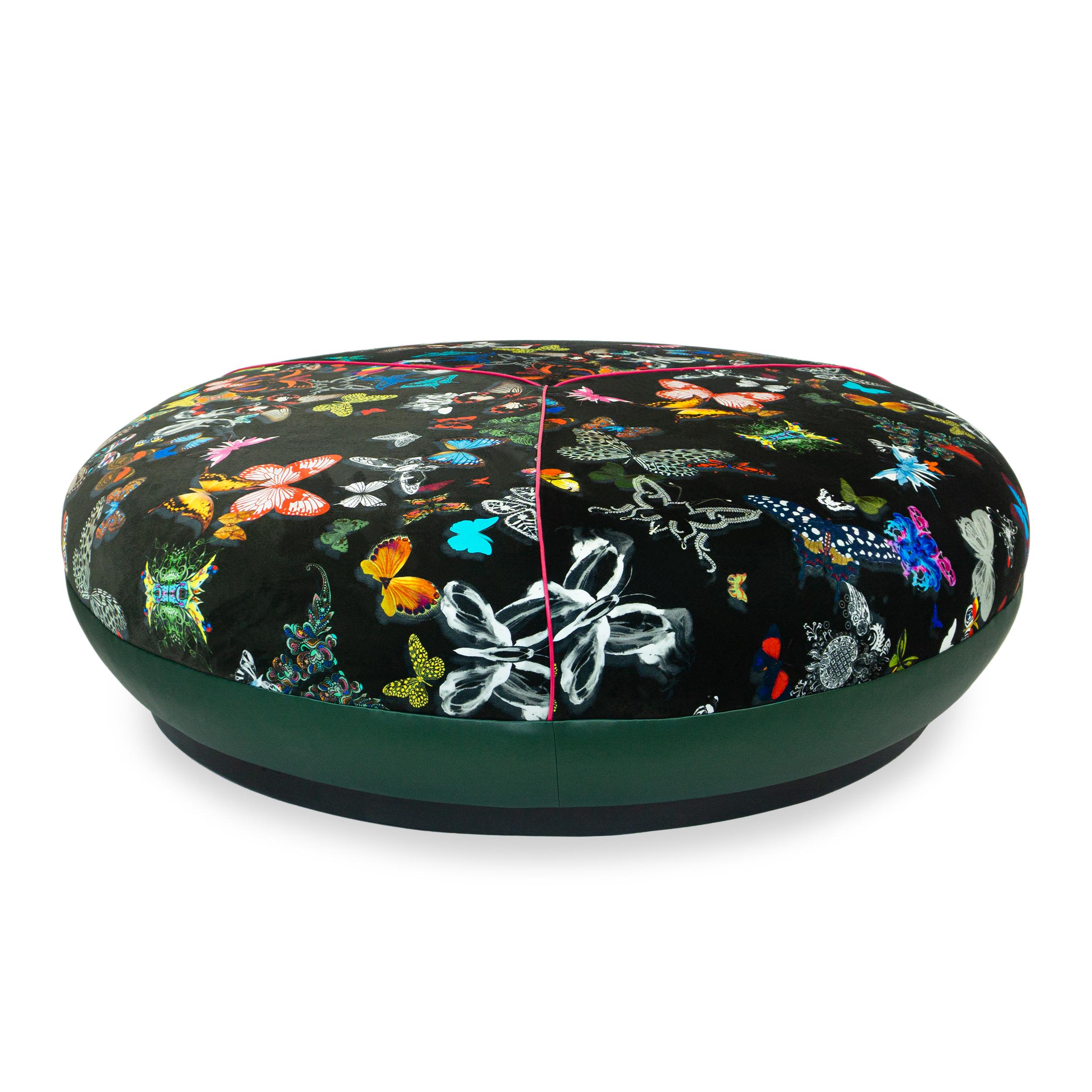 About this piece
Sprawling low round ottoman upholstered in a butterfly print fabrics featuring embroidery, cut velvet, and jacquard and with a vinyl plinth base with a stained wood platform. Seat is firm and crowned but can support a tray. Vinyl