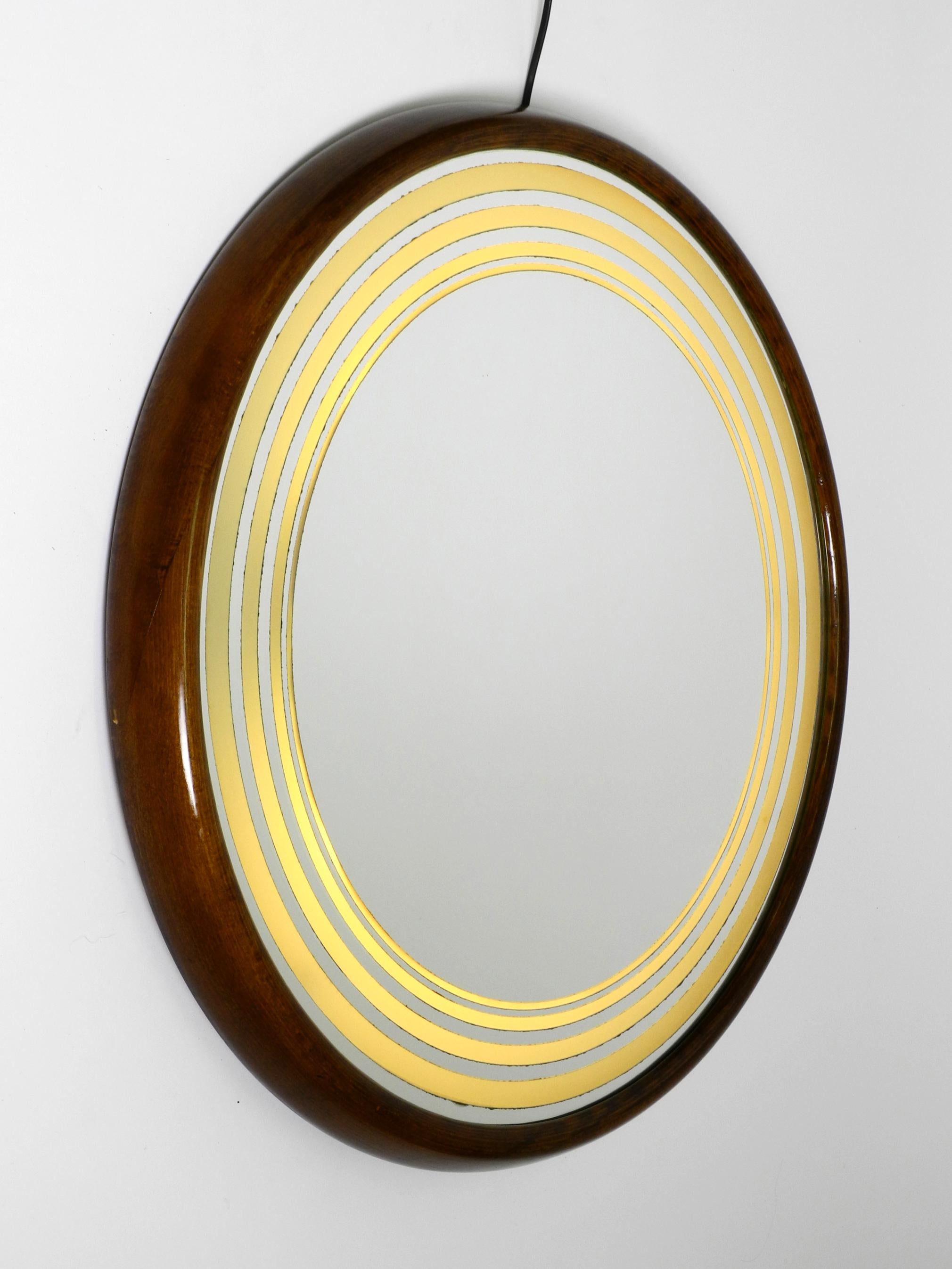 Mid-Century Modern Large round very rare Italian 1960s illuminated walnut wall mirror For Sale
