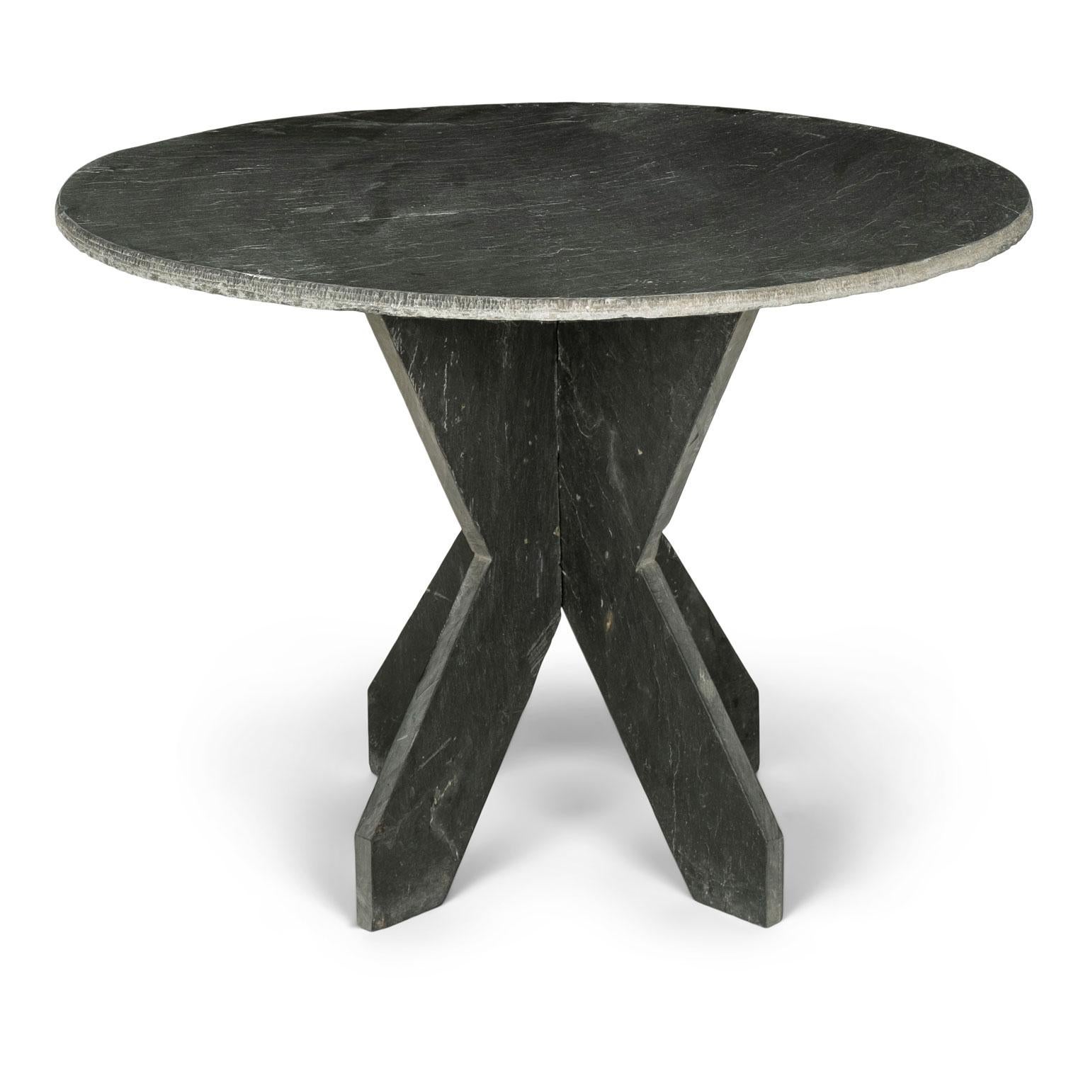 Large round vintage slate table from France, raised upon two-part shaped slate base.
