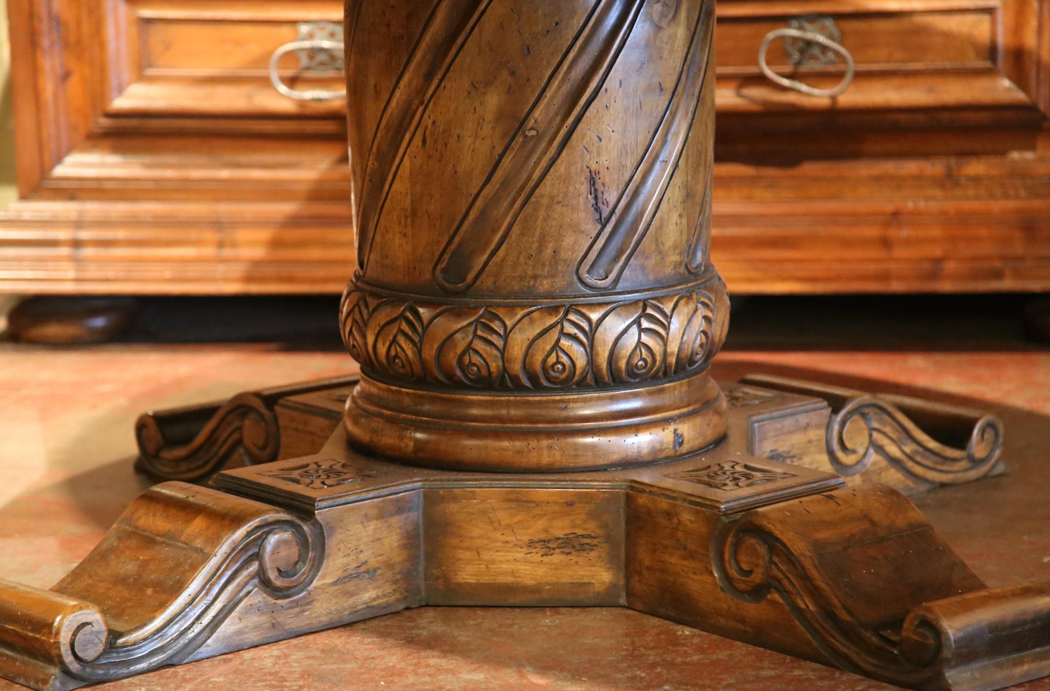 Large Round Walnut Table with Carved Center Pedestal and Geometric Design In Excellent Condition In Dallas, TX