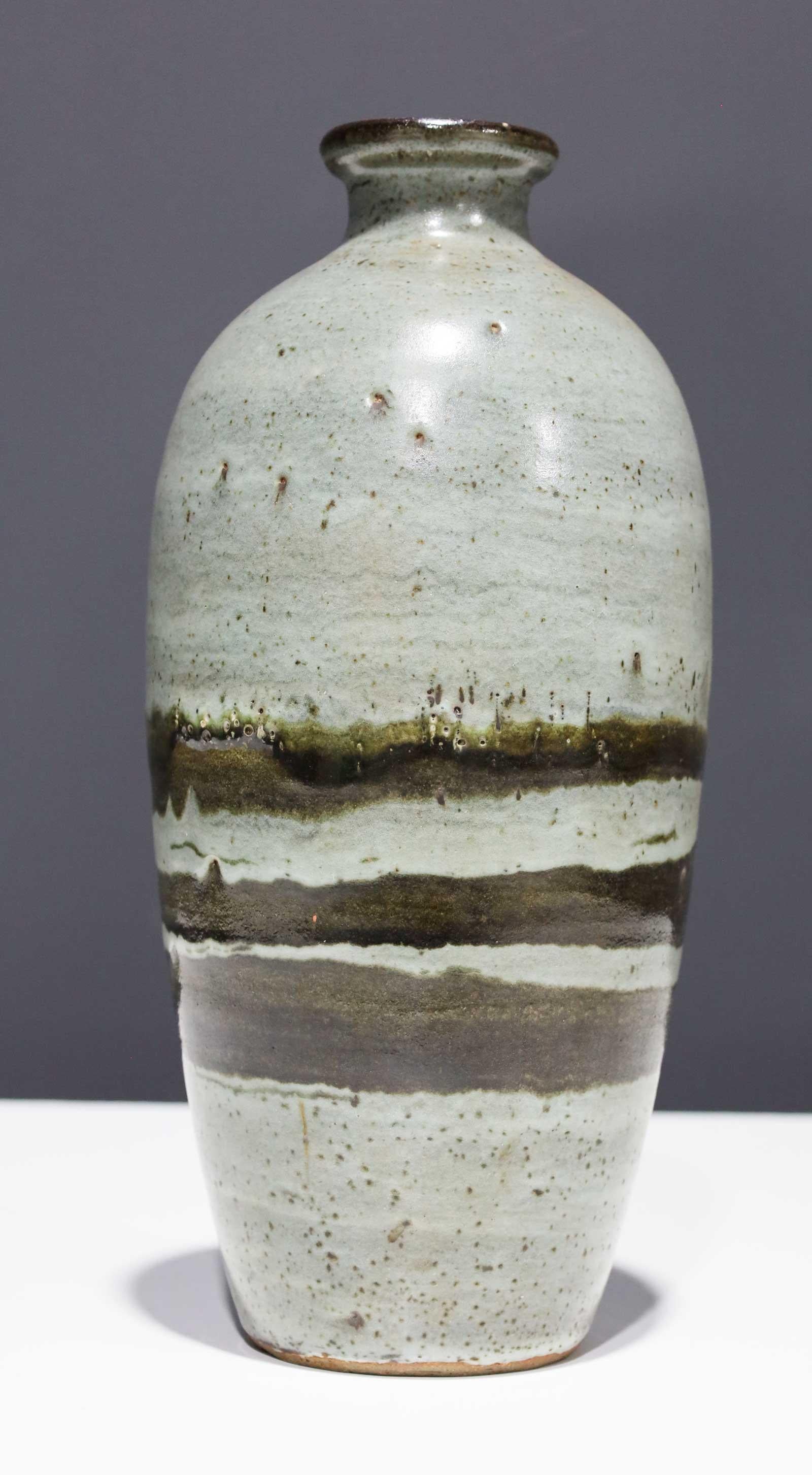 green and white distressed vase