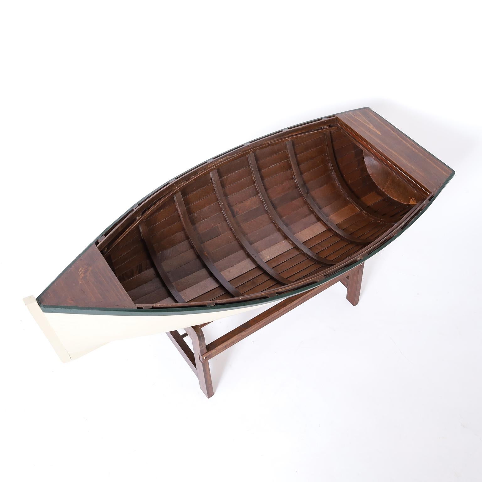 Vintage row boat model hand crafted in mahogany with ambitious accuracy. Painted white with green trim and presented in a custom handcrafted stand.