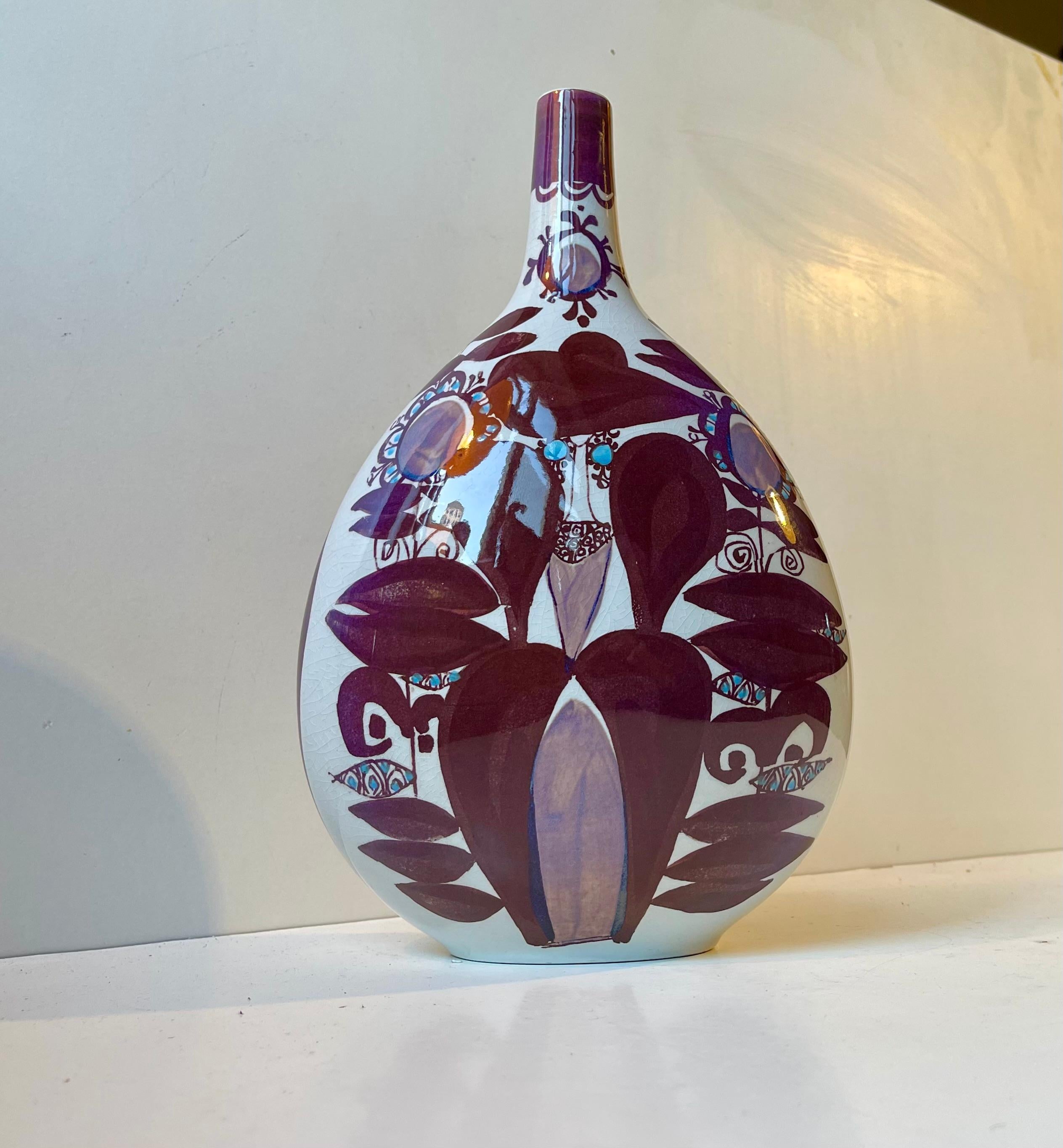 A large Danish faience vase decorated in bright maroon, purple and blue glazes. Ovoid - organic in shape. Designed by female ceramist Kari Christensen during the late 1960s.  On the verso marked with the Aluminia hallmark with the 3 waves (Royal