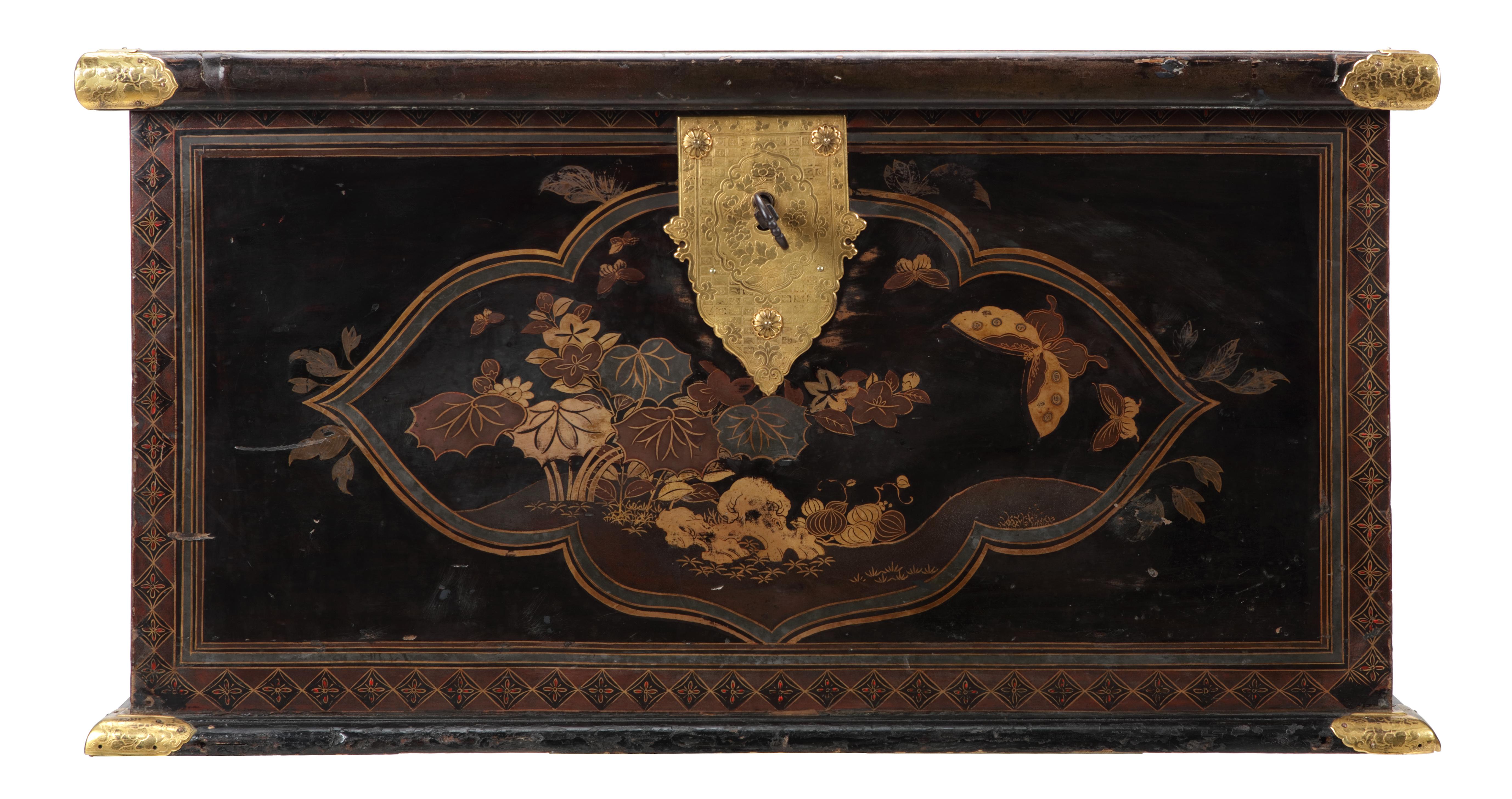 A large Japanese transitional lacquer chest with gilt-metal mounts

Edo period, early 17th century

The rectangular chest with flat hinged lid decorated in gold, silver, and red lacquer, hiramaki-e, takamaki-e, kirikane and nashiji, the top