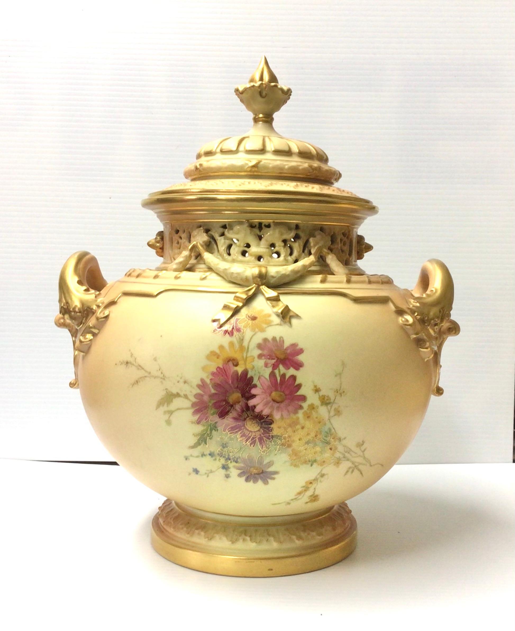 Magnificent large Royal Worcester antique blush ivory bow urn vase complete with original cover,beautifully painted with flowers and foliage.
Measures: 14ins tall x 11ins diameter
Dated 1912.