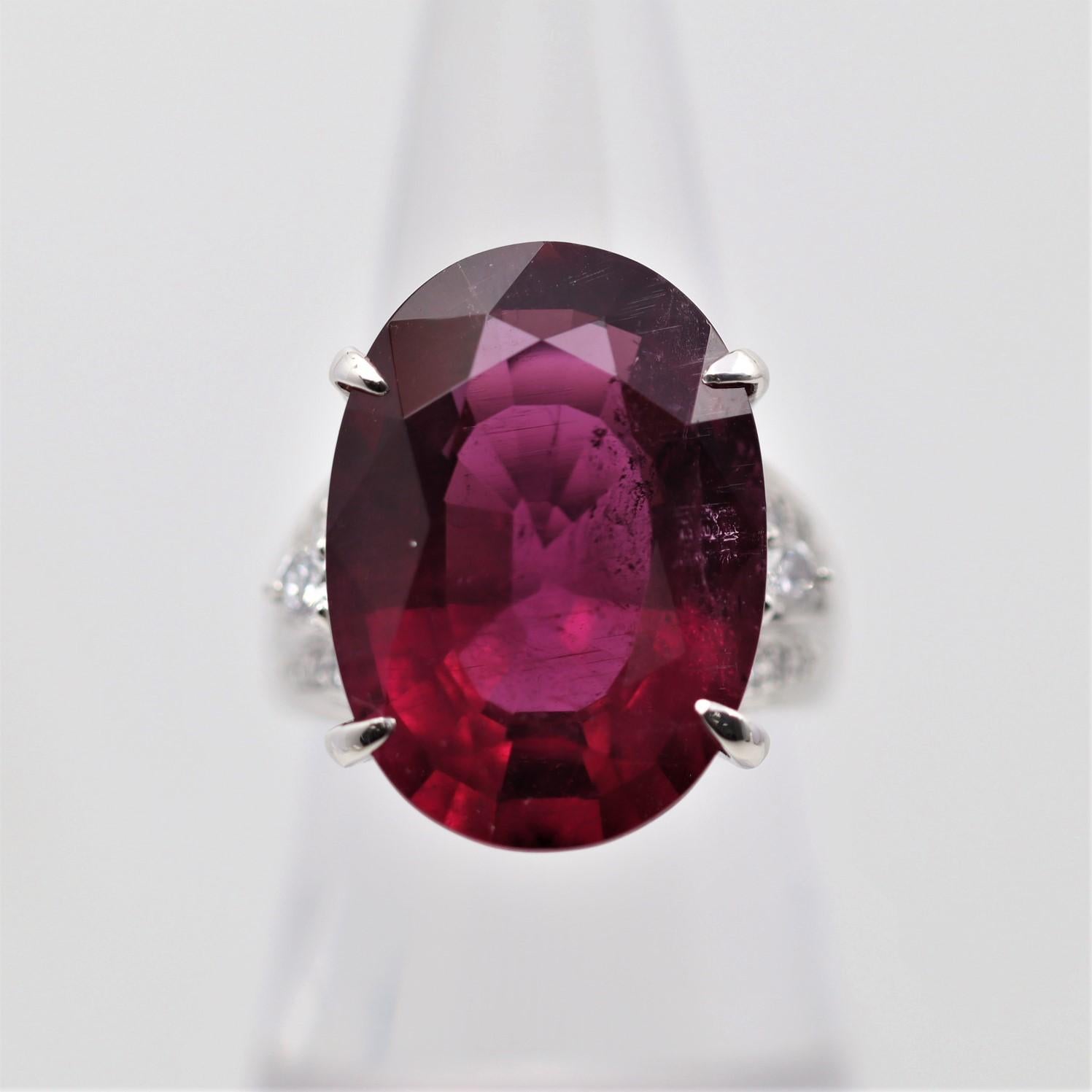 A large and impressive ring featuring a substantial 18.48 carat rubellite tourmaline. It has a deep jelly red color that will leave you smiling. It is complemented by 0.43 carats of diamonds set on its shoulders. Hand-fabricated in platinum and