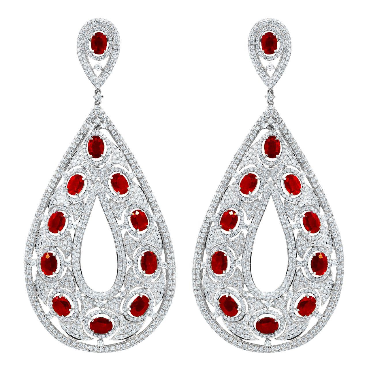 18K White gold Pear shape large size, over-sized ruby and diamond earrings, features  22.91 Carats Of rubies and 15.03 carats of white diamonds. 
4.5