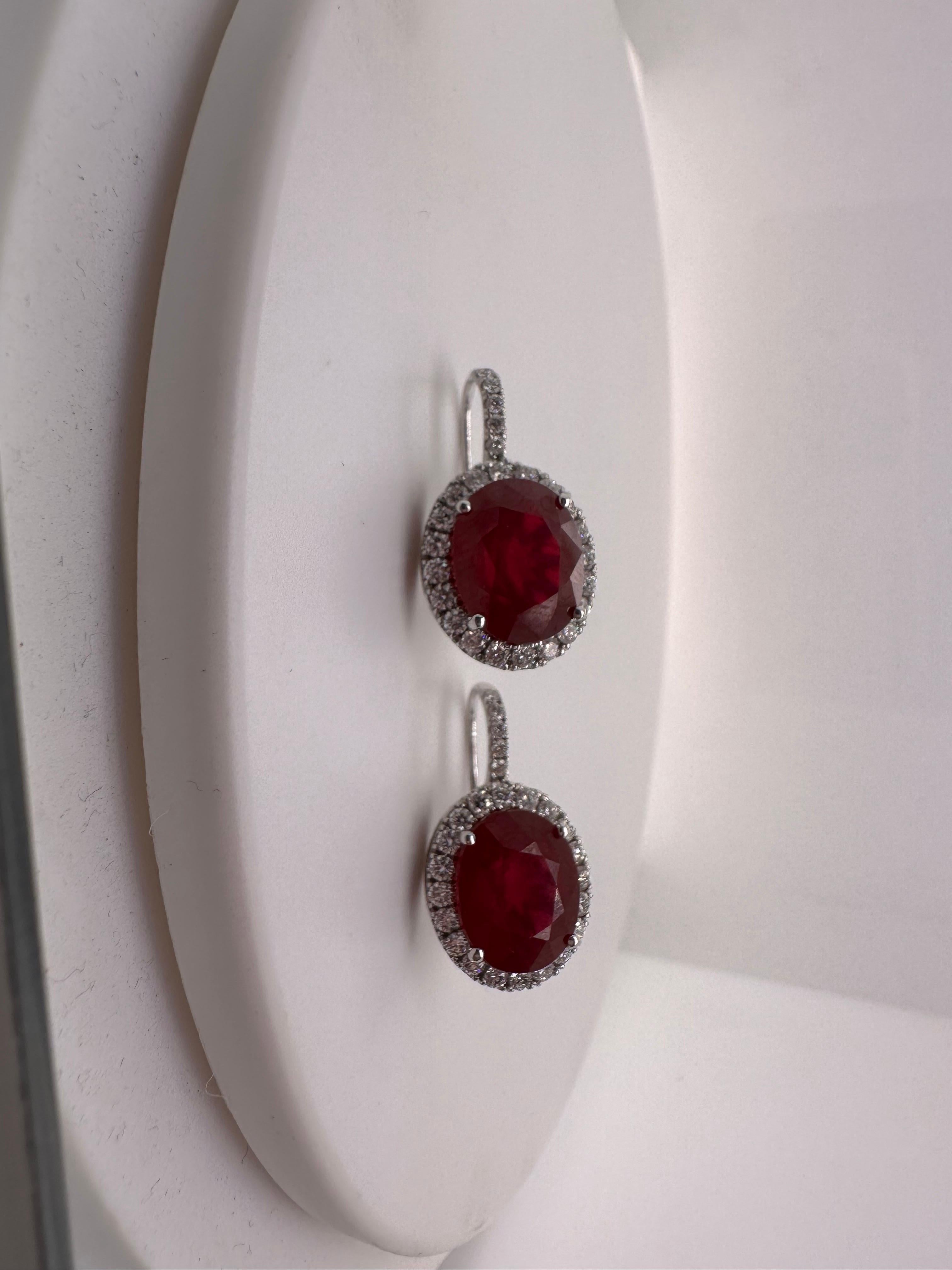 Large diamond earrings with stunning red rubies in the center made in 14KT white gold. The rubies are enhanced hence the price is not that high!

Metal Type: 14KT
Rubies:20ct approximately (natural but enhanced)
Natural Diamond(s): 
Color: