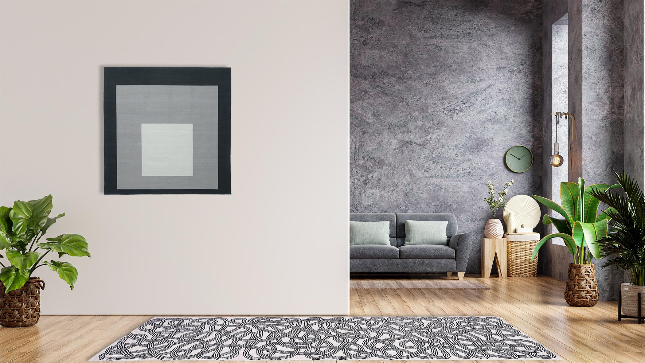 This classic, black and white hand-tufted wool runner by Anni Albers is adapted from a 1959 runner design and is available in two sizes. The piece features an enticing lattice of loosely woven laces that creates a friendly, energetic design perfect
