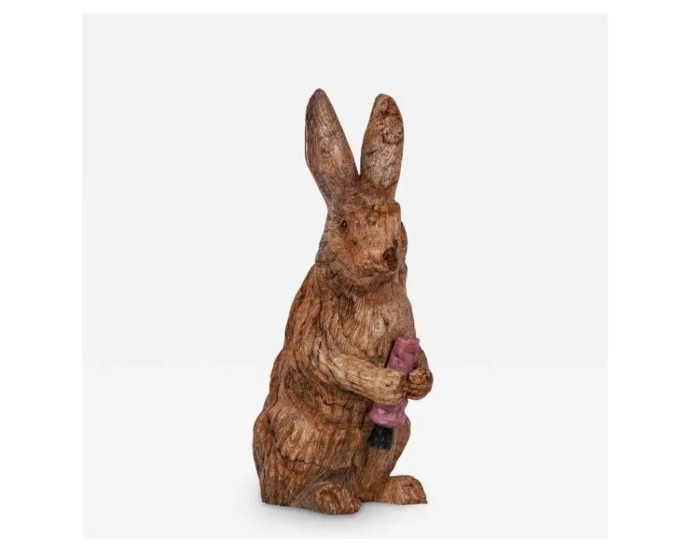A large Russian carved Jasper hardstone figure of a rabbit, in the style of Faberge.

With 14K gold and ruby eyes.

Realistically carved, figure of a bunny rabbit holding a carrot carved from rhodonite and nephrite, set with ruby and gold