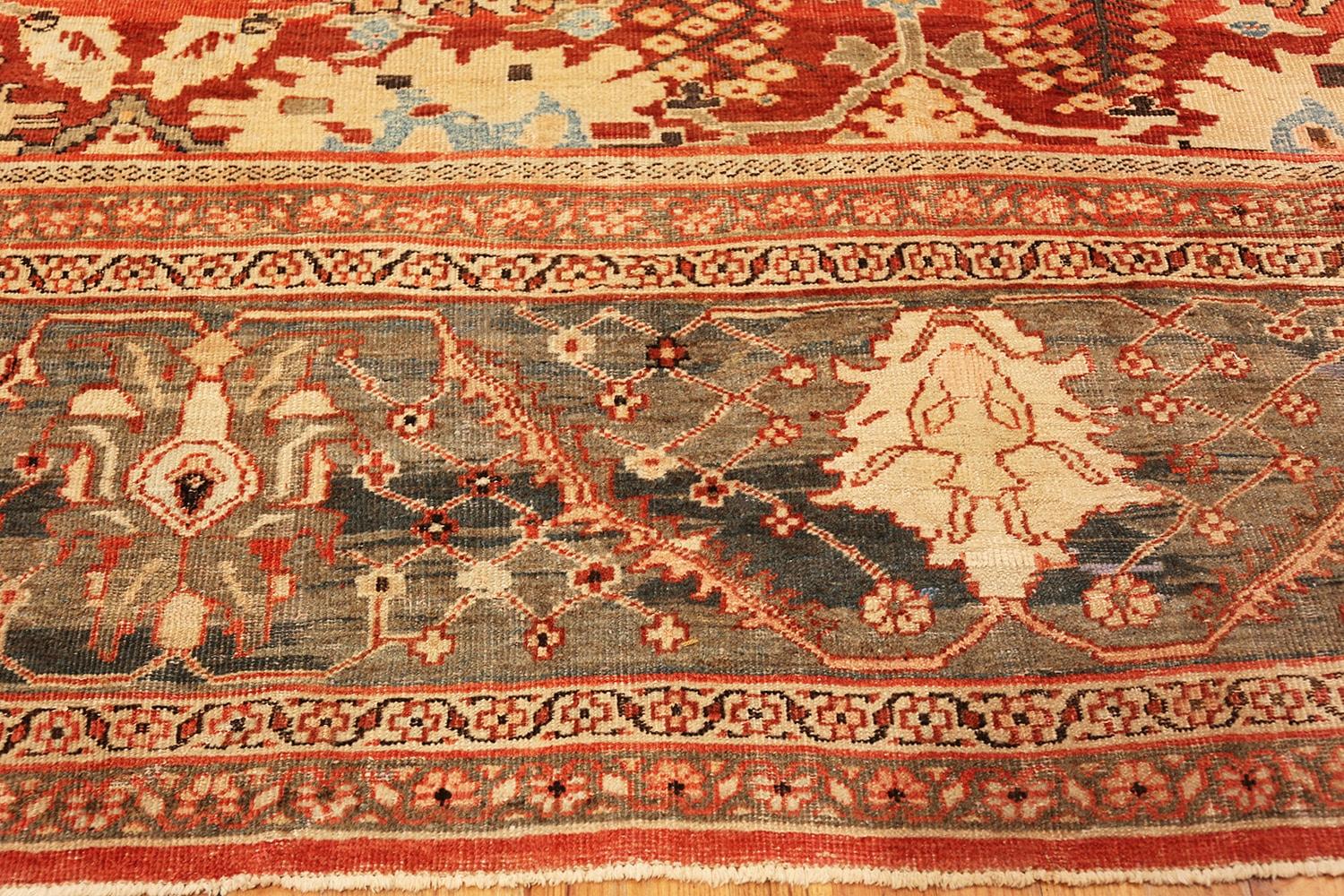 An Impressive Large Size Rustic Antique Persian Sultanabad Carpet, Country of Origin / rug type: Persian rugs, Circa date: 1880's. Size: 14 ft 4 in x 19 ft 4 in (4.37 m x 5.89 m)

 