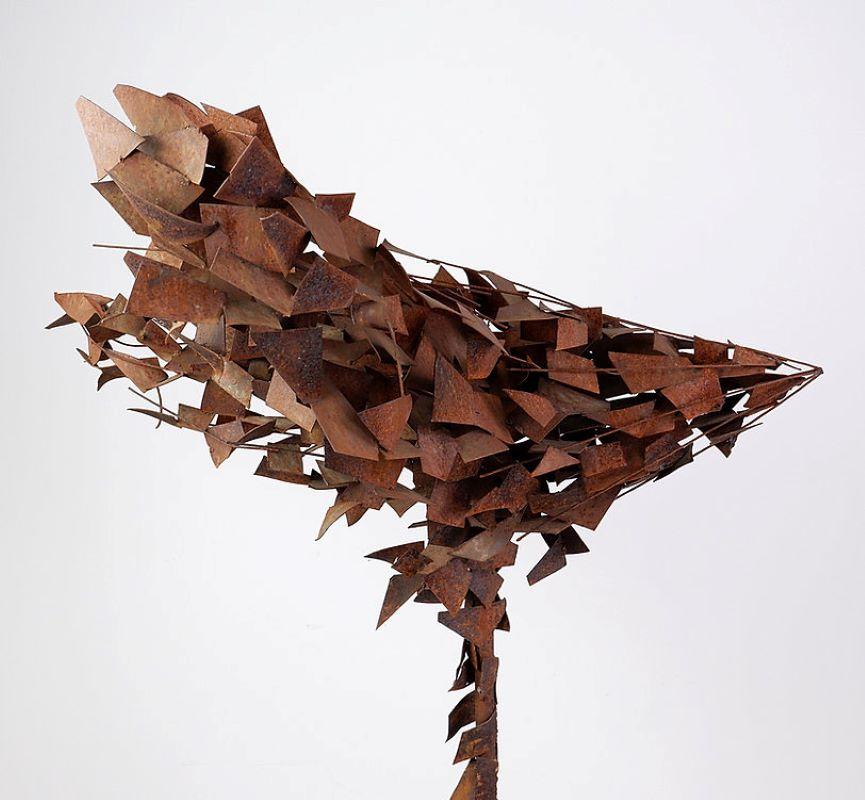 Brutalist figurative sculpture made out of rusted metal, reminds us of a tree moved by the wind. Perfect decoration for the garden. 