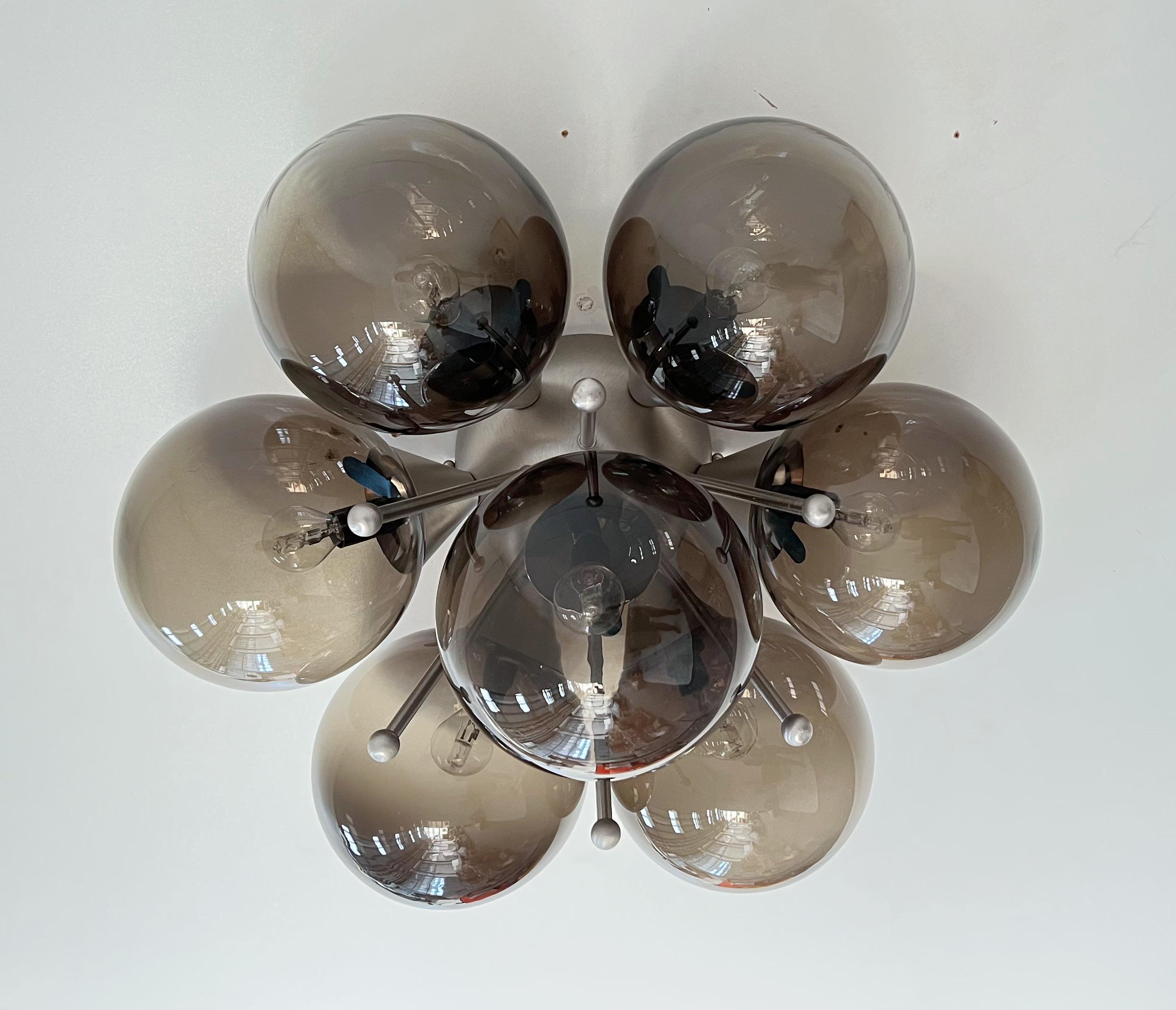 Italian flush mount with large Murano glass globes mounted on solid brass frame in satin nickel finish
Designed by Fabio Bergomi / Made in Italy 7 lights / E12 or E14 type / max 40W each 
Diameter: 25.5 inches / Height: 14 inches 
Order only / This