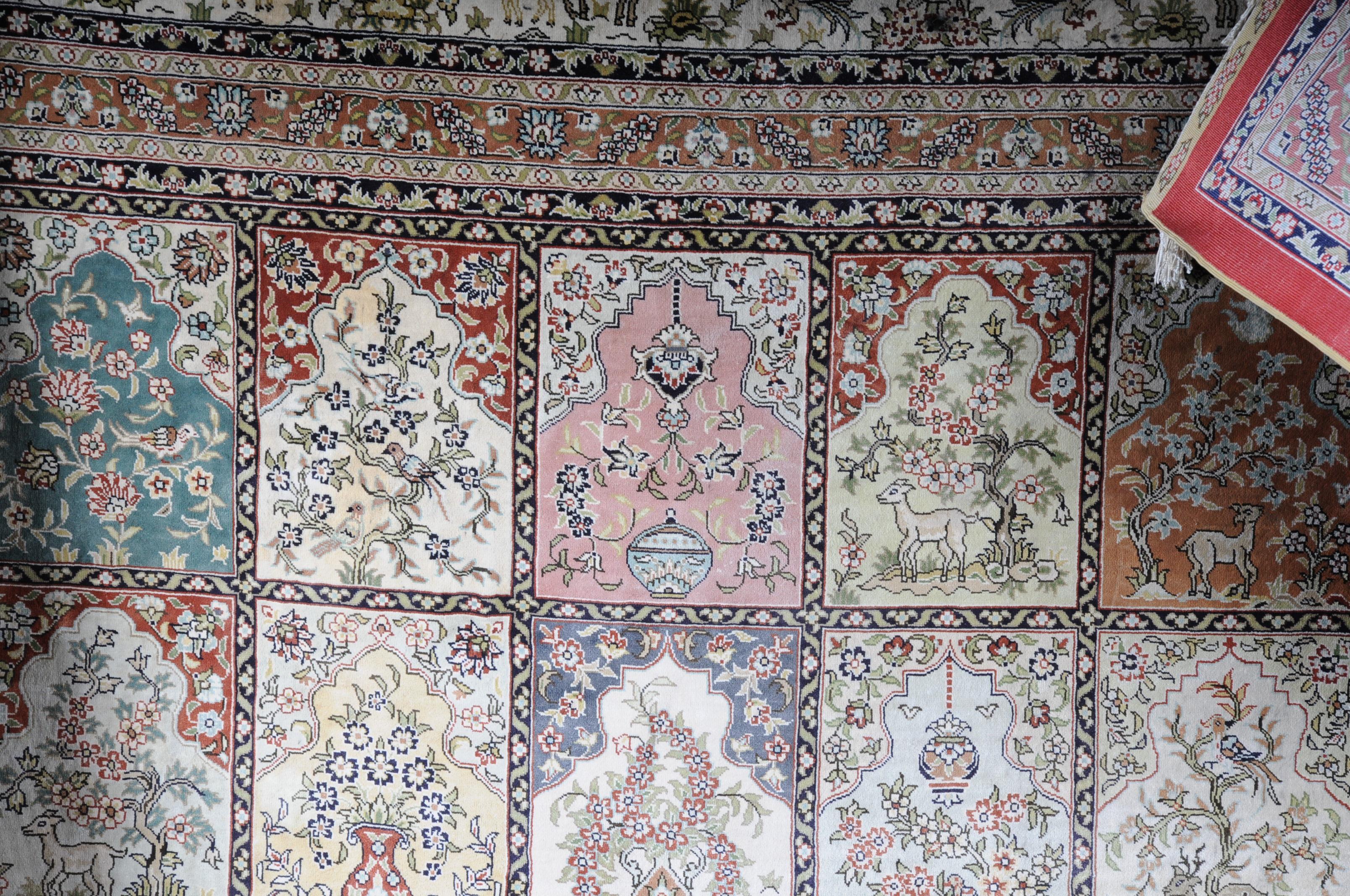 Large Salon carpet, silk on silk, 20th century.

Beautiful Persian carpet with a row of mandala windows.
Magnificent colors identify this symmetrical represent and finely knotted carpet.
Brightly colored mirror with field-filling