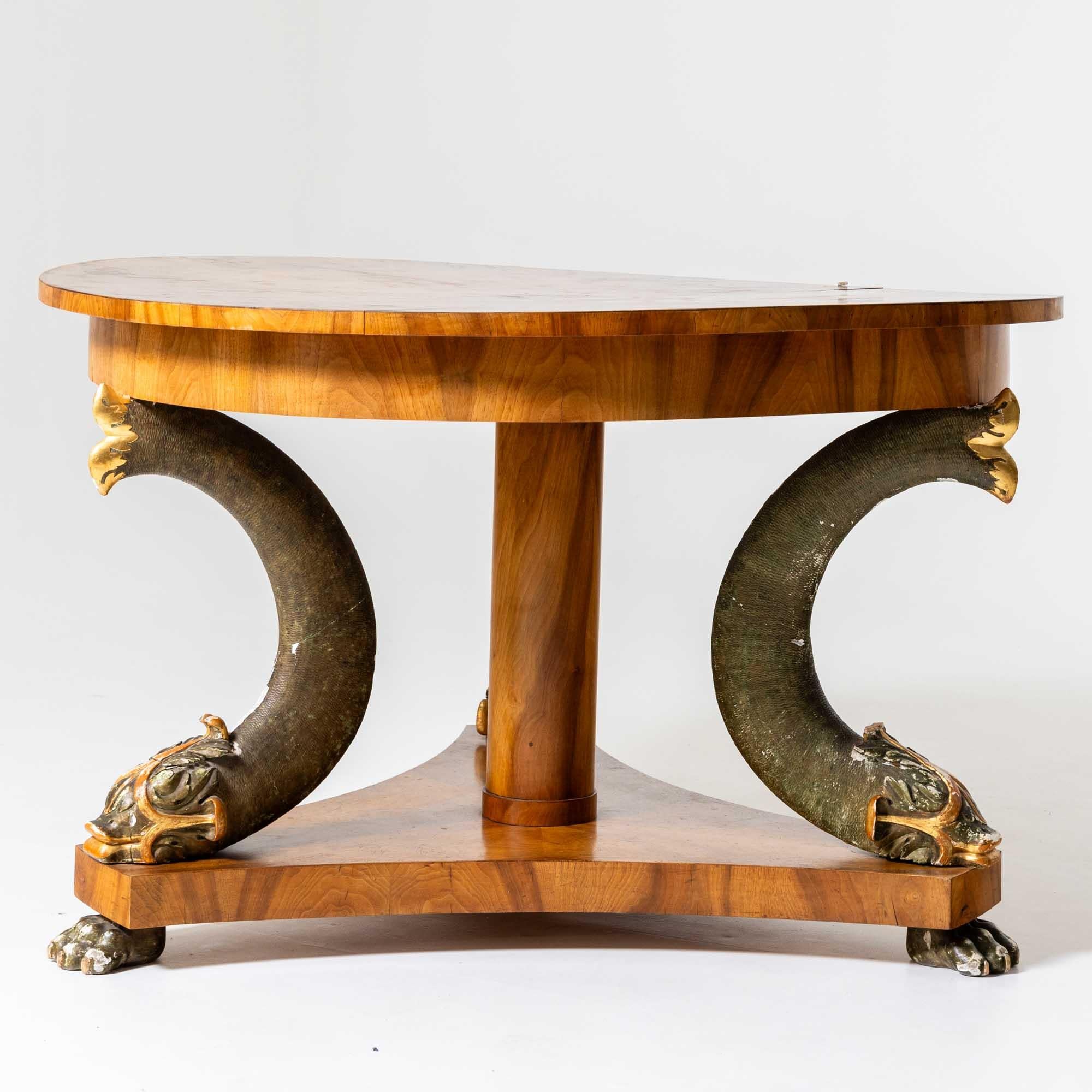 Early 19th Century Large Salon Table with Walnut Veneer and carved Dolphins, Germany circa 1820