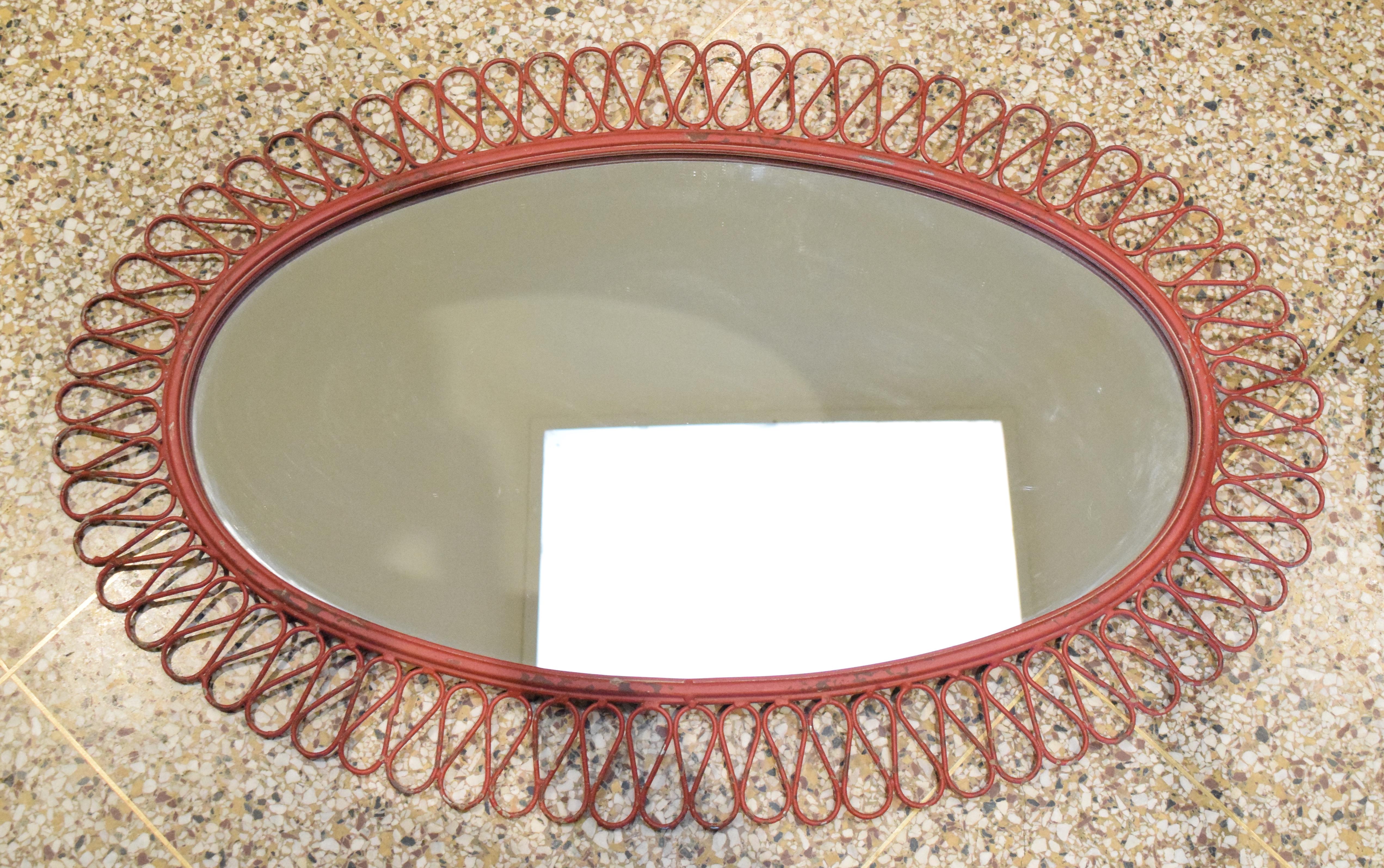 Oval wall mirror in original red finish by Maurizio Tempestini for John Salterini.