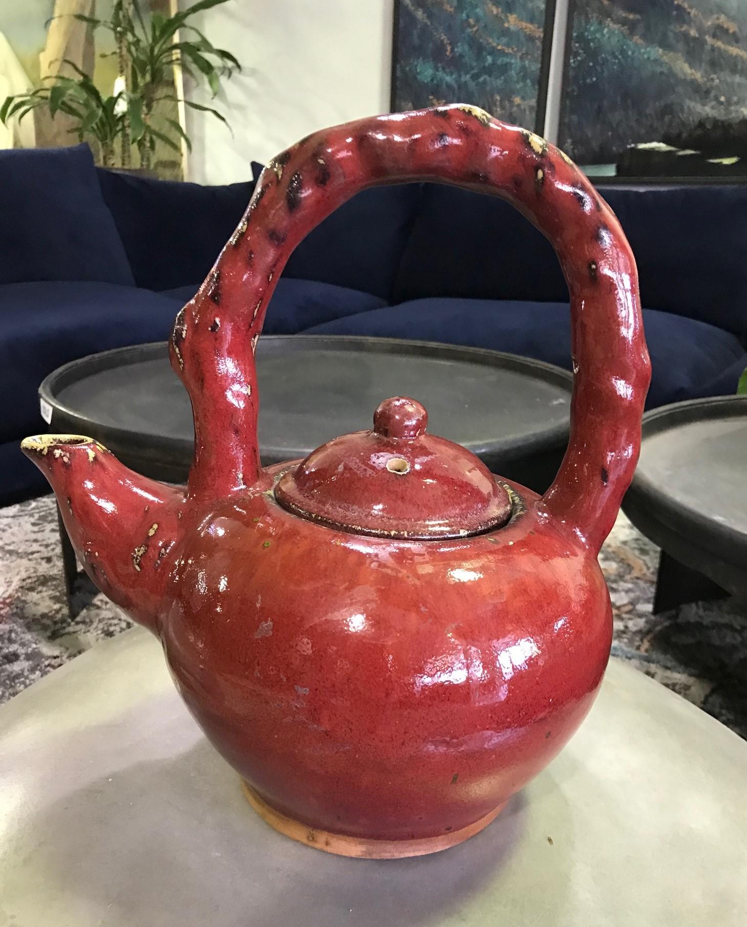 A beautiful and richly colored ceramic Japanese tea pot with sangue de boeuf glaze. Very arresting color and design.

Would stand out in about any collection or setting.

Dimensions: 14