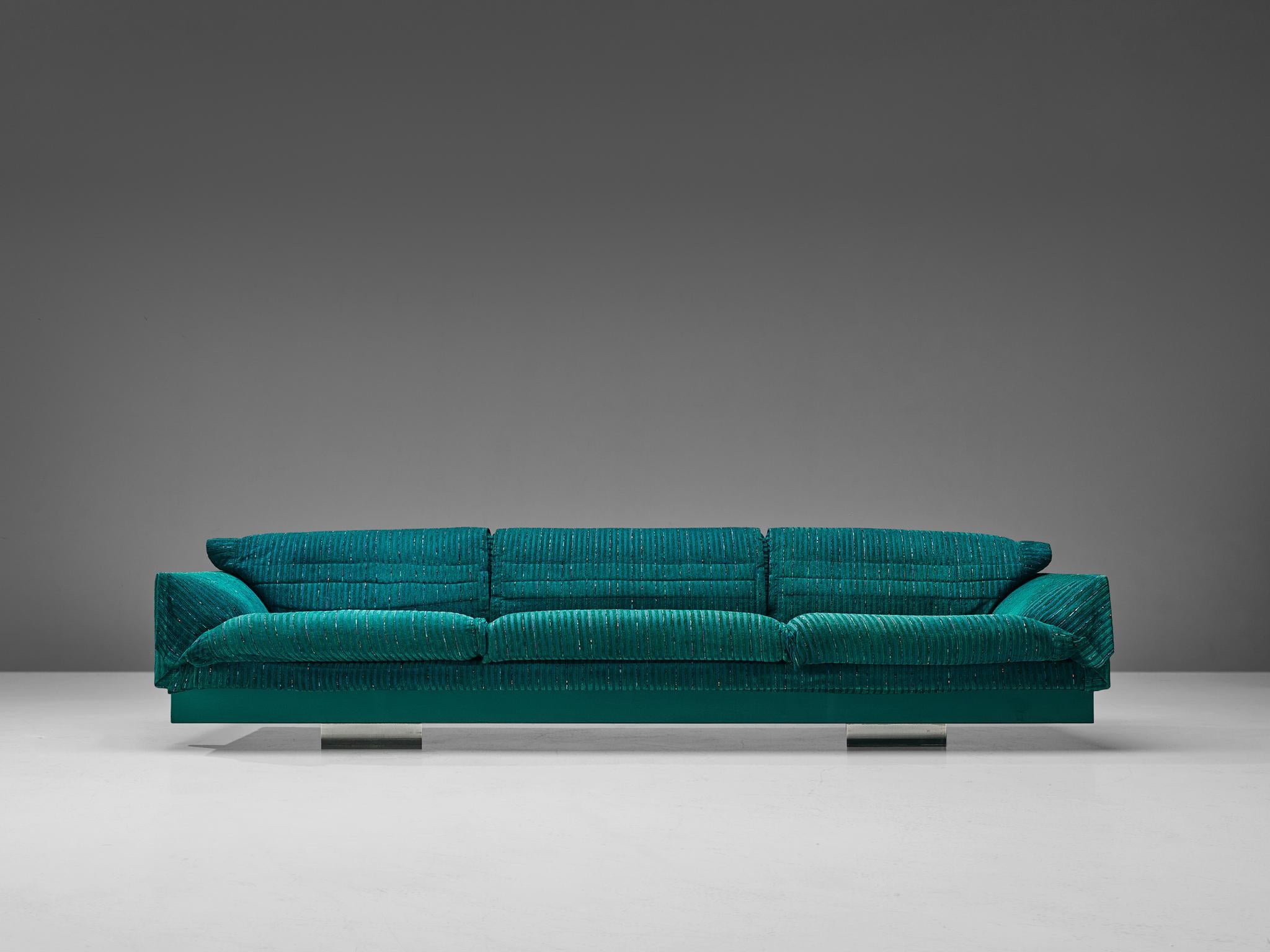 Saporiti, sofa, upholstered in green-blue textured fabric with metal legs, Italy, 1960s.

Large sofa manufactured by Saporiti. This sofa is designed to be comfortable, soft and inviting. It has three seats with round sloping armrest, creating a